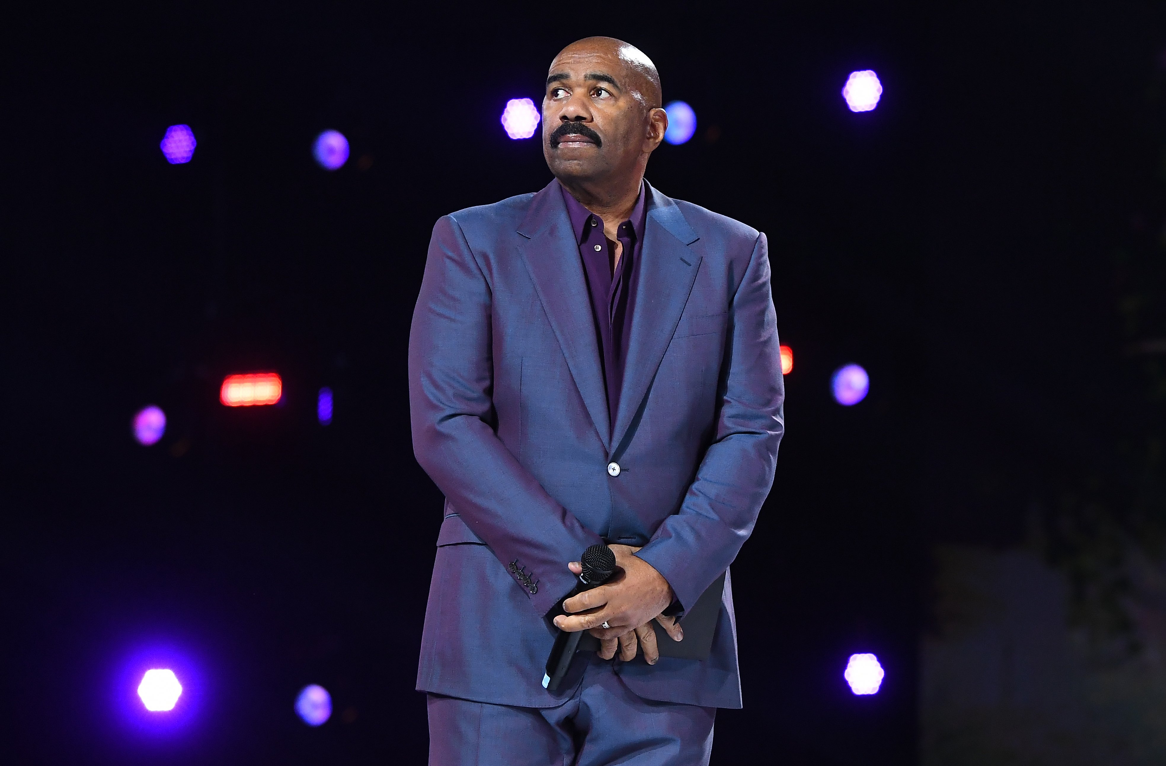 Steve Harvey onstage during the Beloved Benefit at Mercedes-Benz Stadium in Atlanta, Georgia. | Photo: Getty Images