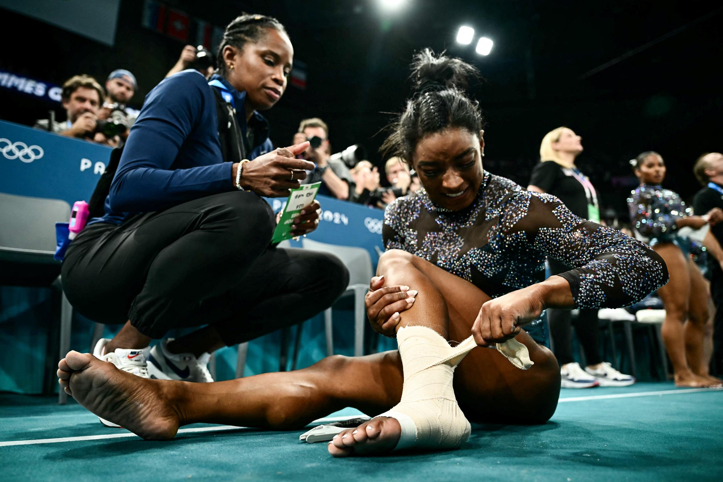 Marcia Faustin and Simone Biles during the Artistic Gymnastics Women's Qualification in Paris, France on July 28, 2024 | Source: Getty Images