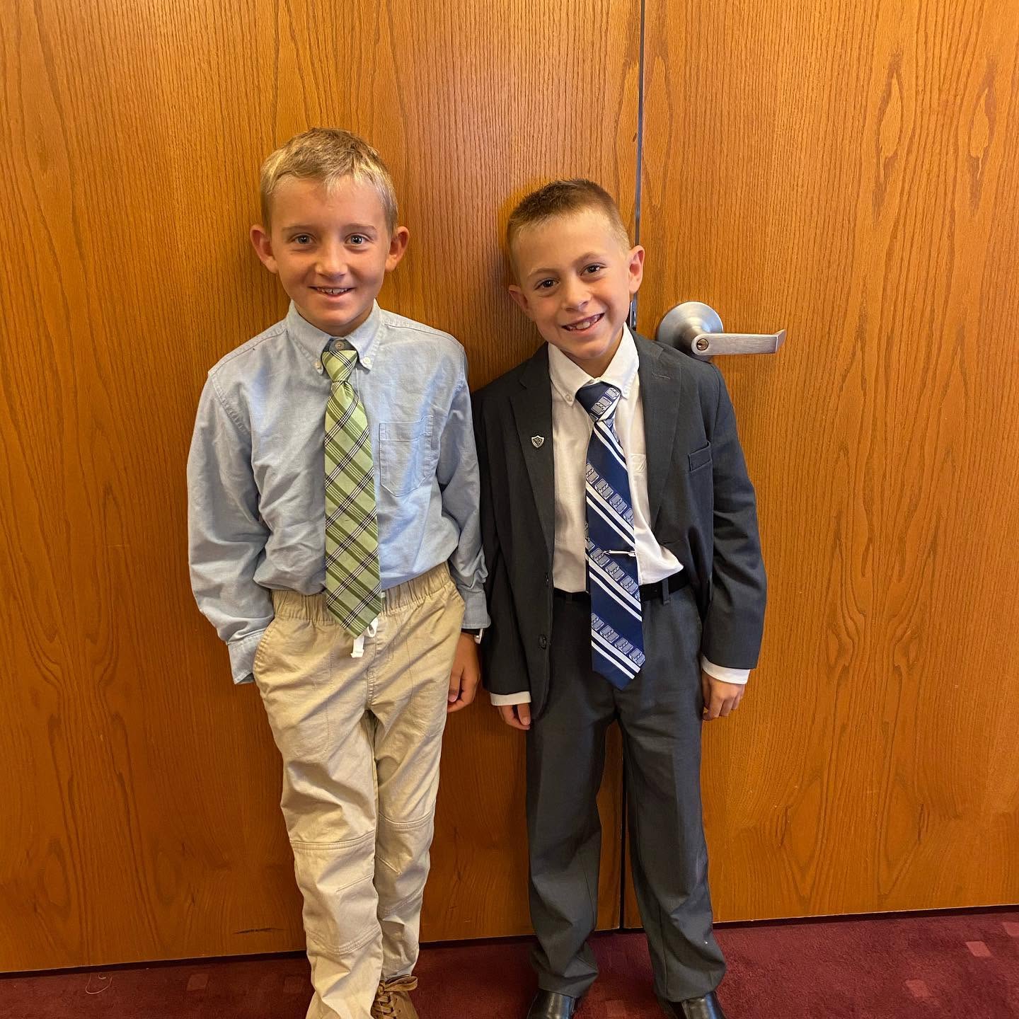 The two younger boys show off their matching suits and bright grins, capturing the playful camaraderie shared among the brothers. | Source: Facebook/katrina.g.long