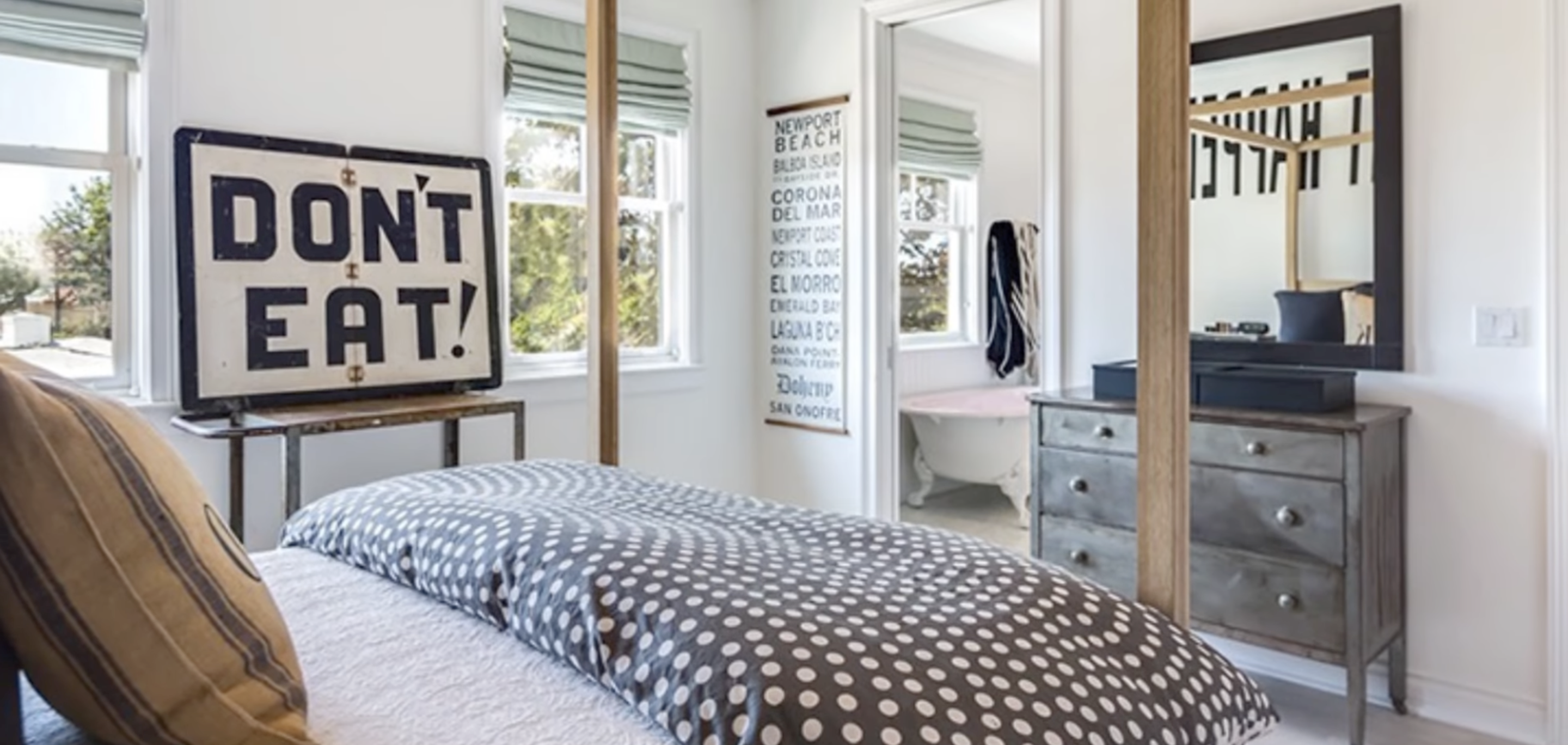 Bedroom featuring a “DON’T EAT!” sign and polka-dot bedding inside Diane Keaton’s Sullivan Canyon home, dated February 3, 2022 | Source: YouTube/@FamousEntertainment500k