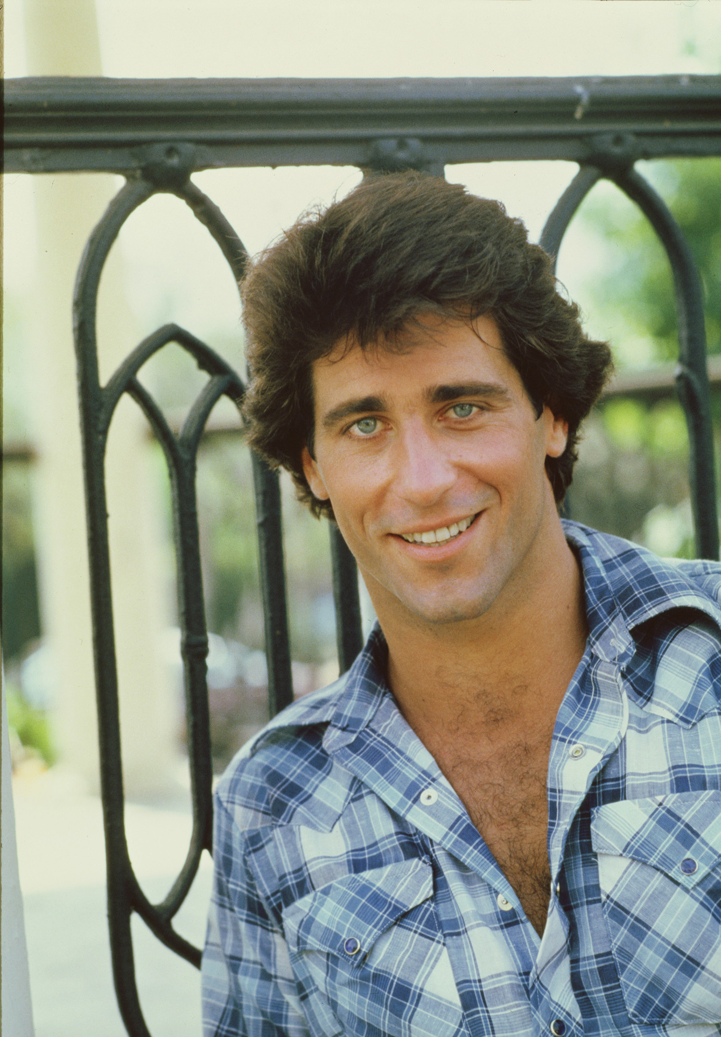 Mayer's 1982 publicity portrait presents Vance Duke in the casual plaid-shirt styling associated with the show's younger male leads. The image captures the brief period when "The Dukes of Hazzard" was introducing him as a new face of Hazzard County. | Source: Getty Images