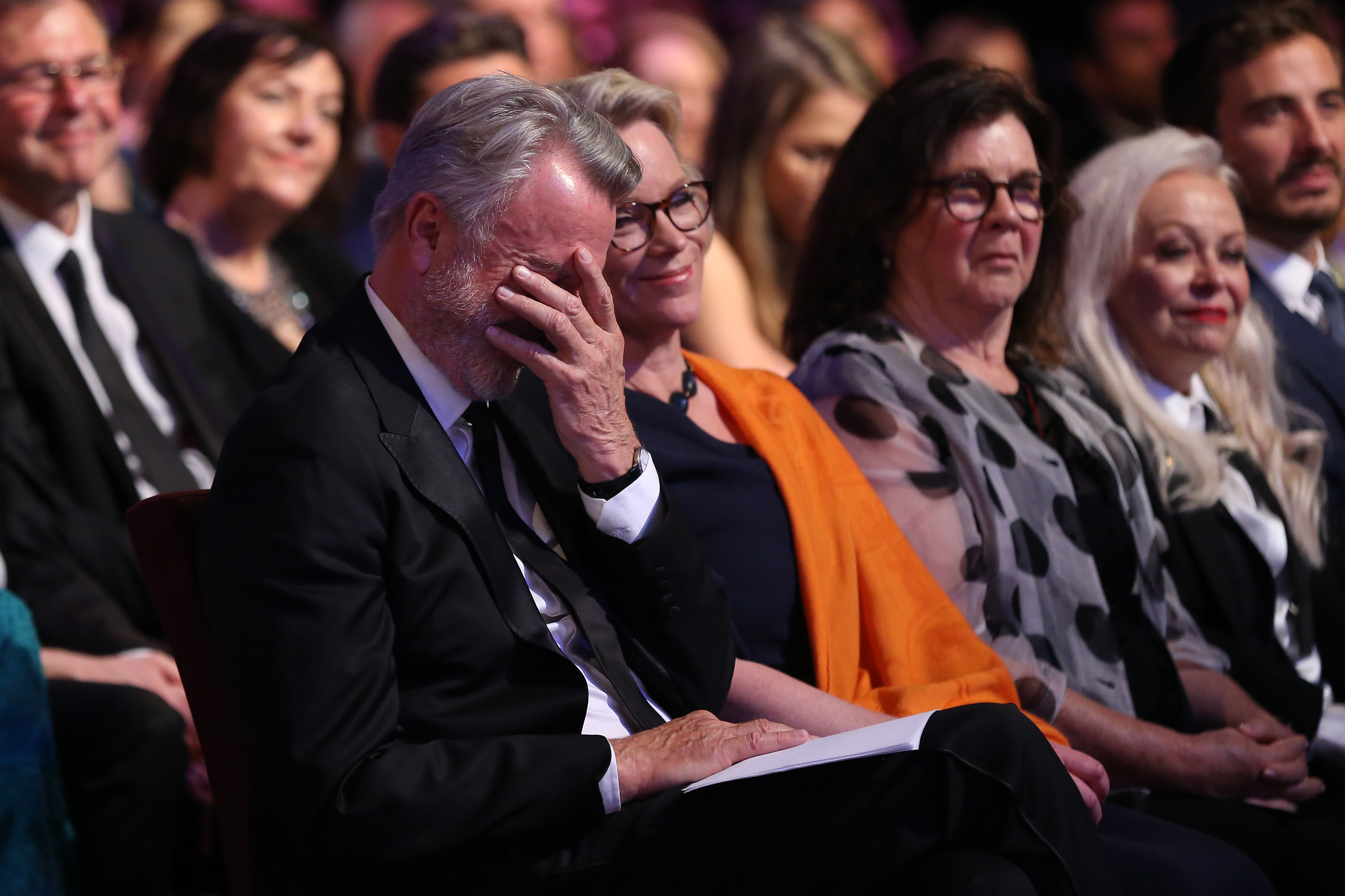 Sam Neill sitting alongside Laura Tingle during the 2019 AACTA Awards at The Star on December 4, 2019 in Sydney, Australia | Source: Getty Images