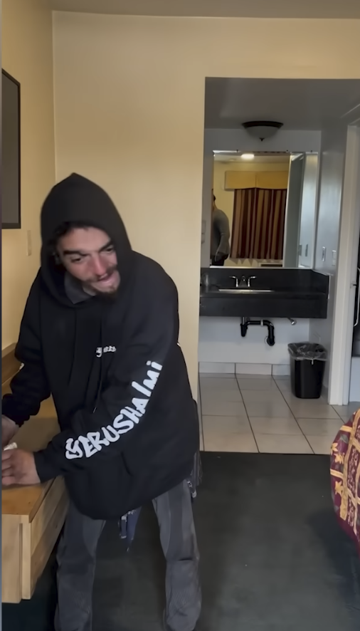 The actor seen in a motel room in a video posted on December 24, 2025 | Source: YouTube/New York Post