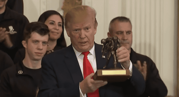 Donald Trump accepts trophy during a Wounded Warrior Project event held at the White House on April 18, 2019. | Source: YouTube/ TIME