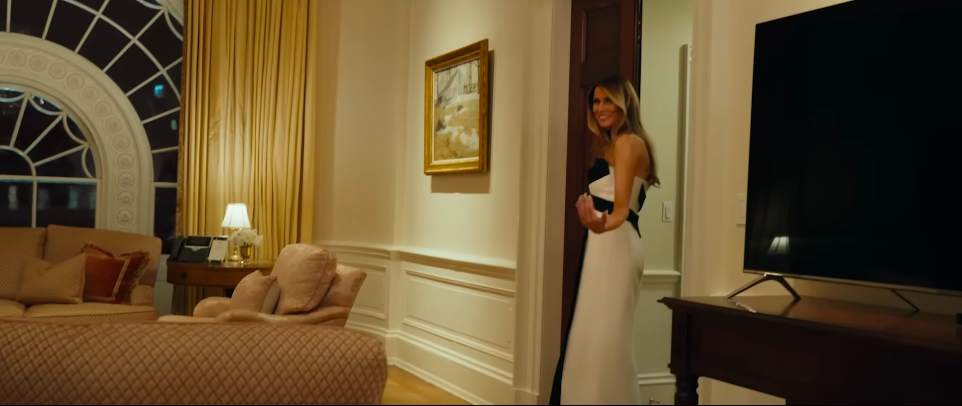 Melania Trump gesturing for the cameraman to follow her along. | Source: YouTube/Amazon MGM Studios