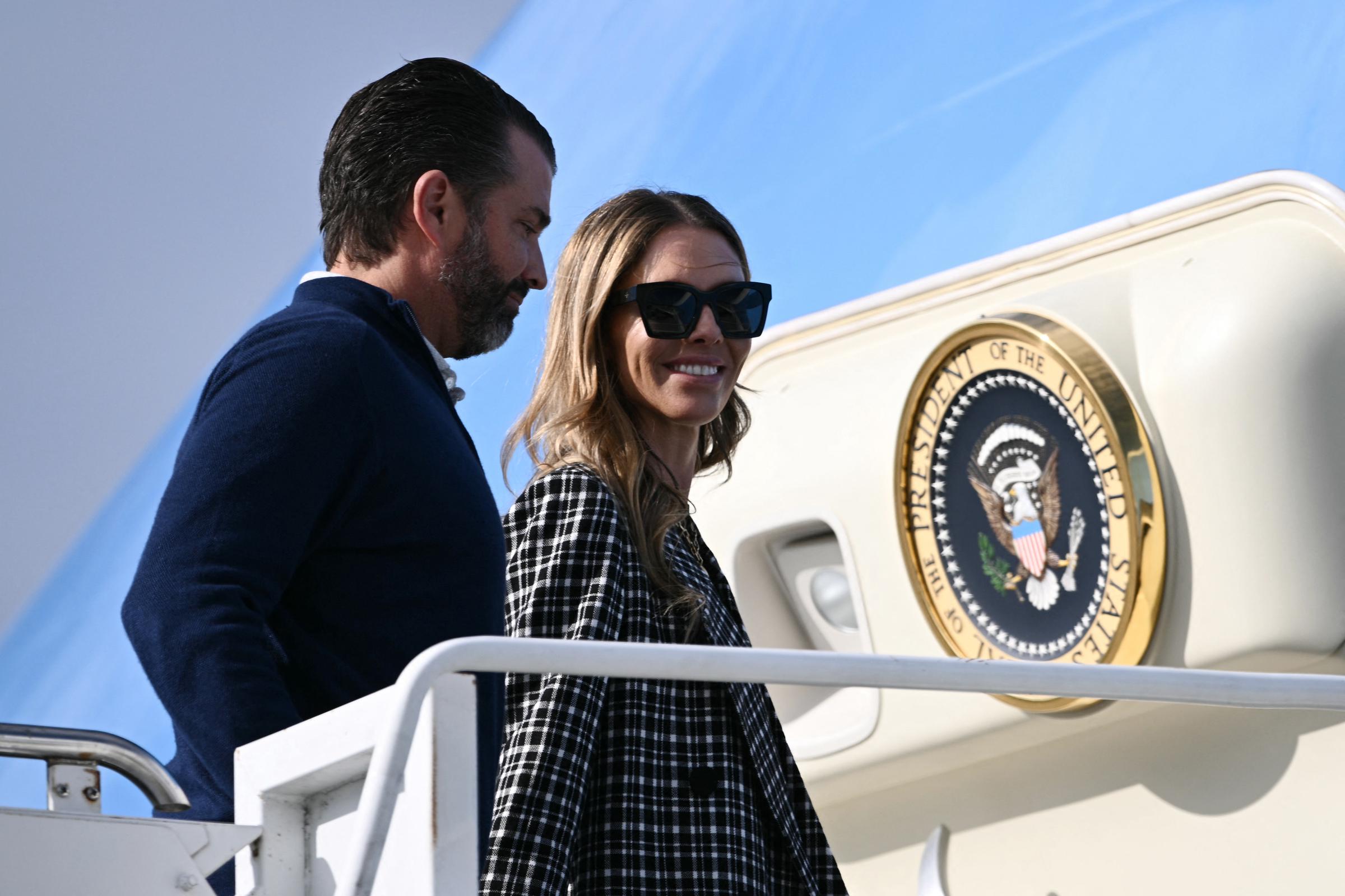 Donald Trump Jr. and Bettina Anderson board Air Force One at RAF Lossiemouth in north-east Scotland on July 29, 2025 | Source: Getty Images