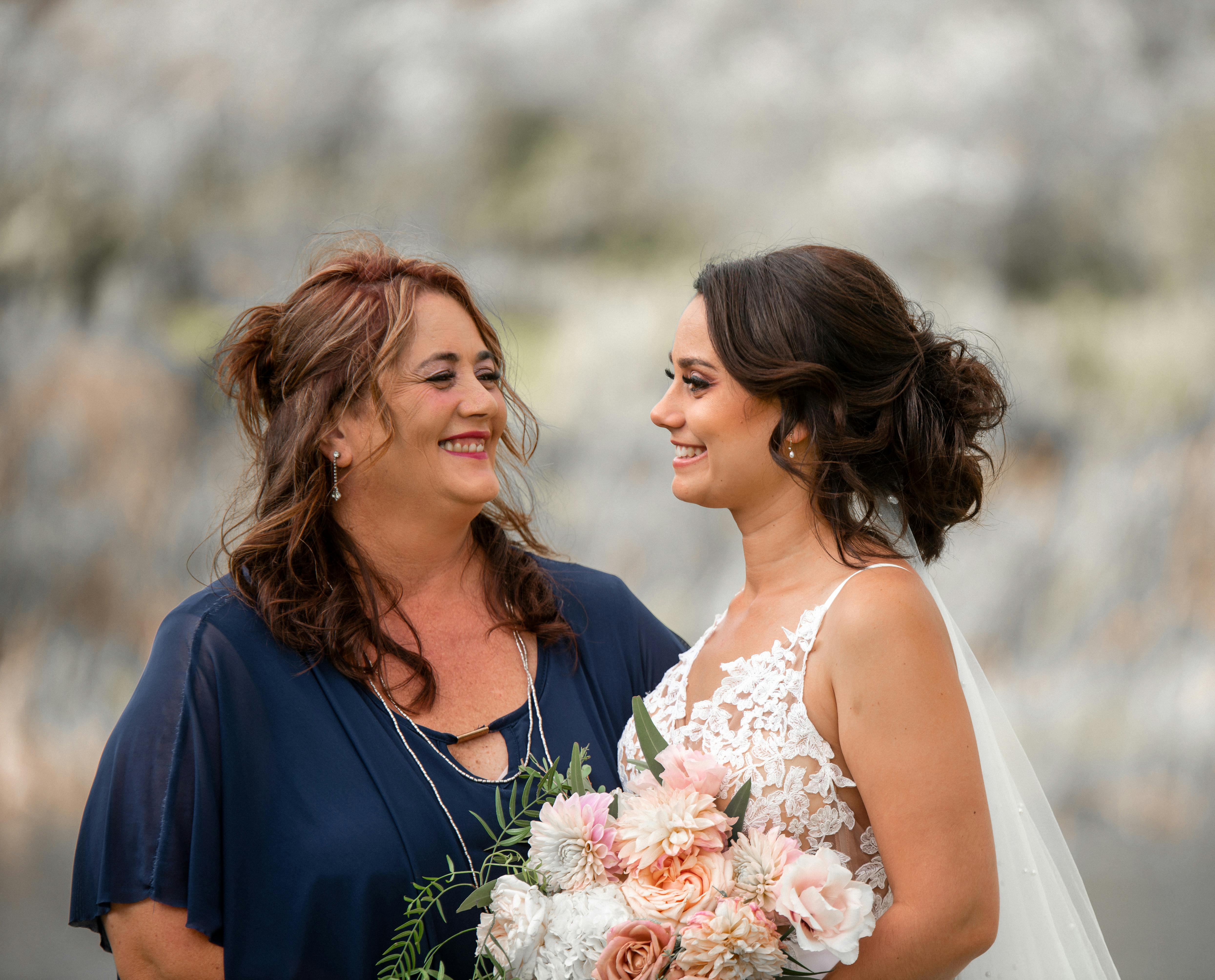 A happy bride and her bridesmaid | Source: Pexels