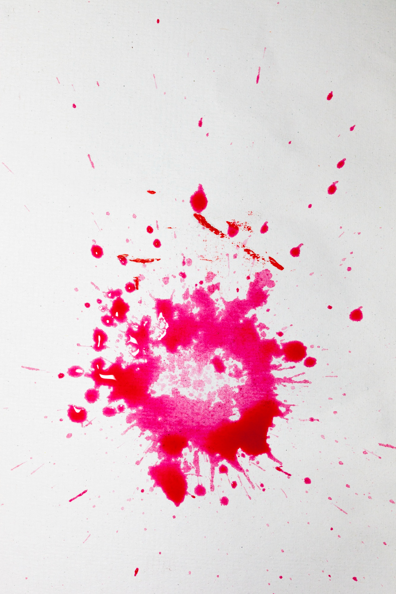 A splatter of red paint on white background | Source: Pexels