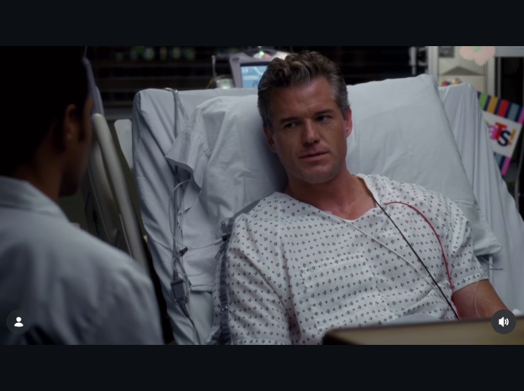 Mark Sloan lies in a hospital bed speaking to a colleague during one of his final episodes on the series. | Source: Instagram/greysabc