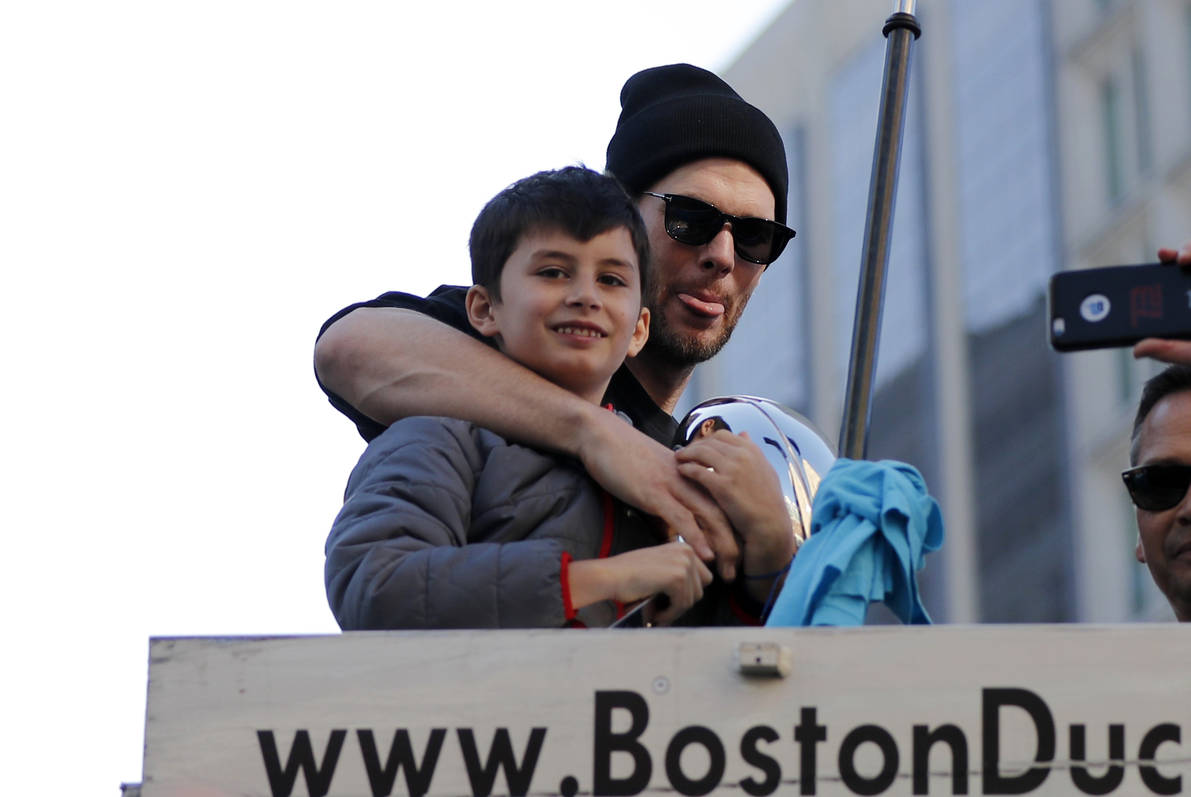 New England Patriots quarterback Tom Brady (12) poses with son Benjamin during the New England Patriots Super Bowl Victory Parade on February 5. 2019, through the streets of Boston, Massachusetts. | Source: Getty Images