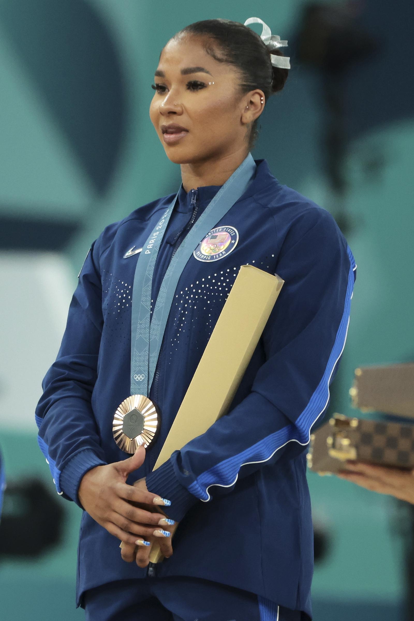 Jordan Chiles poses on the podium at the Artistic Gymnastics Women's Floor Exercise Medal Ceremony on day ten of the Olympic Games at Bercy Arena, on August 05, 2024 in Paris, France | Source: Getty Images