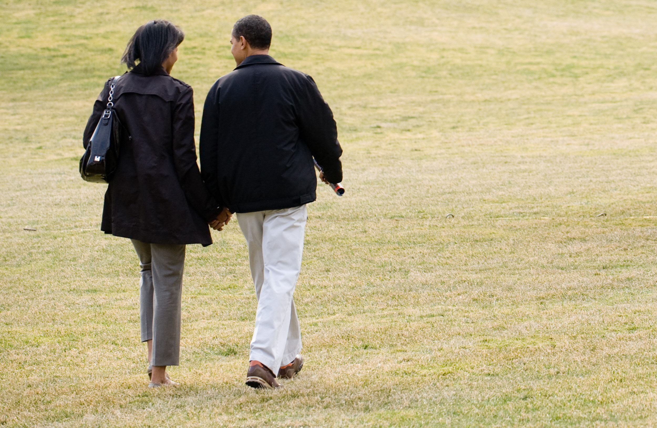 Michelle and Barack Obama walking across the South Lawn of the White House in Washington on March 7, 2009. | Source: Getty Images