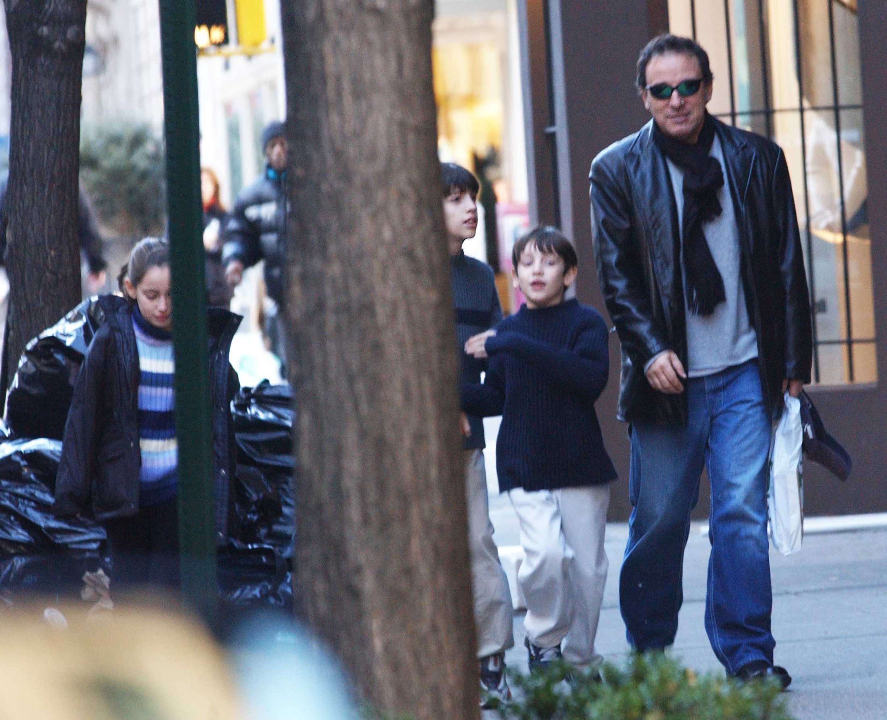 Musician Bruce Springsteen and his children Jessica (L), Evan (C), and Sam (R) spotted taking a walk on February 18, 2002 in New York City. | Source: Getty Images