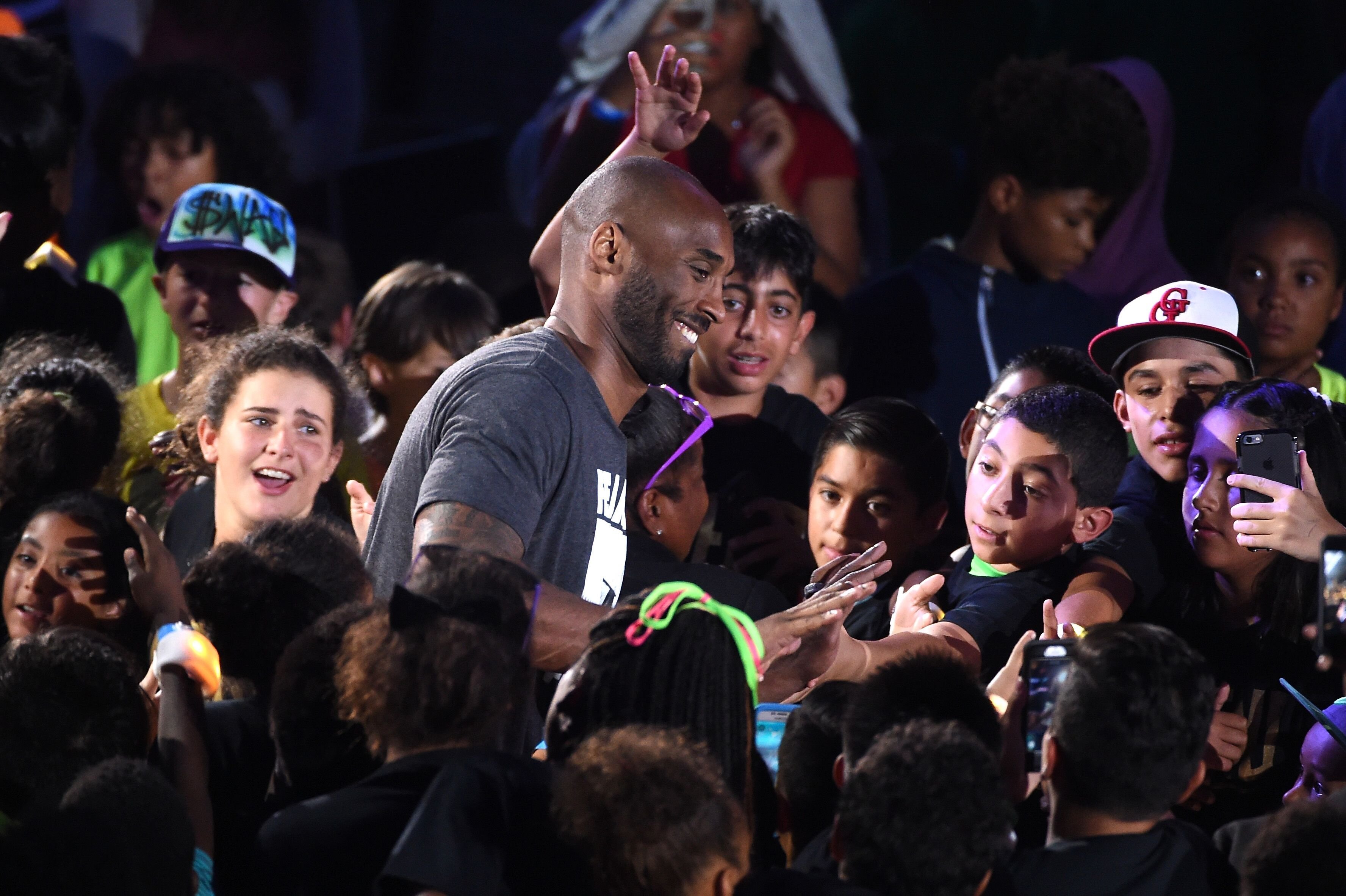 Kobe Bryant amongst a sea of his fans | Source: Getty Images/GlobalImagesUkraine