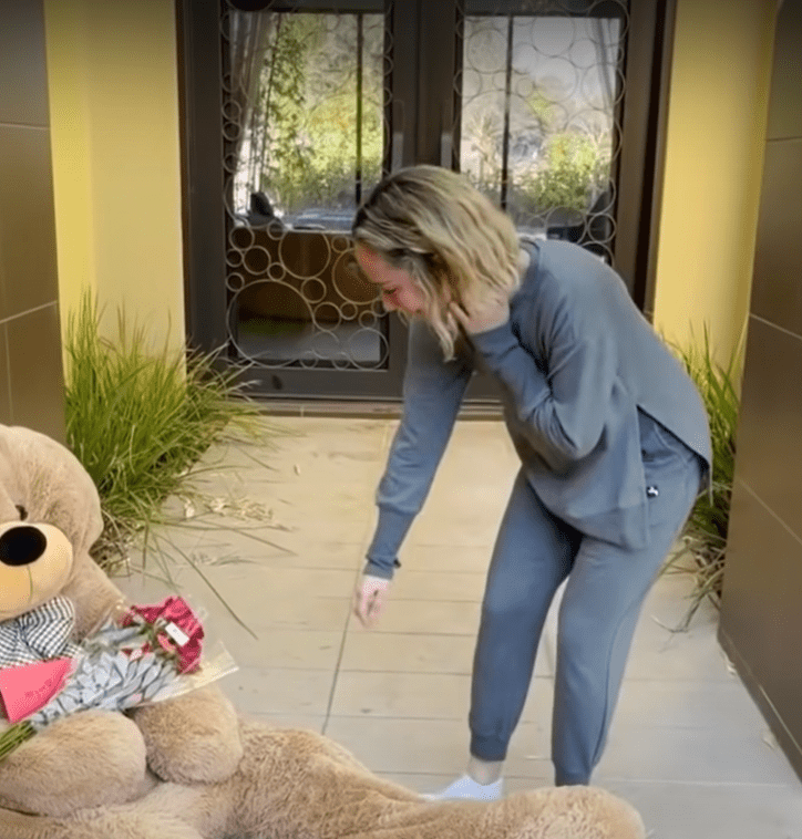 Megan picking up a letter off a Teddy Bear. | Source: youtube.com/Funny World