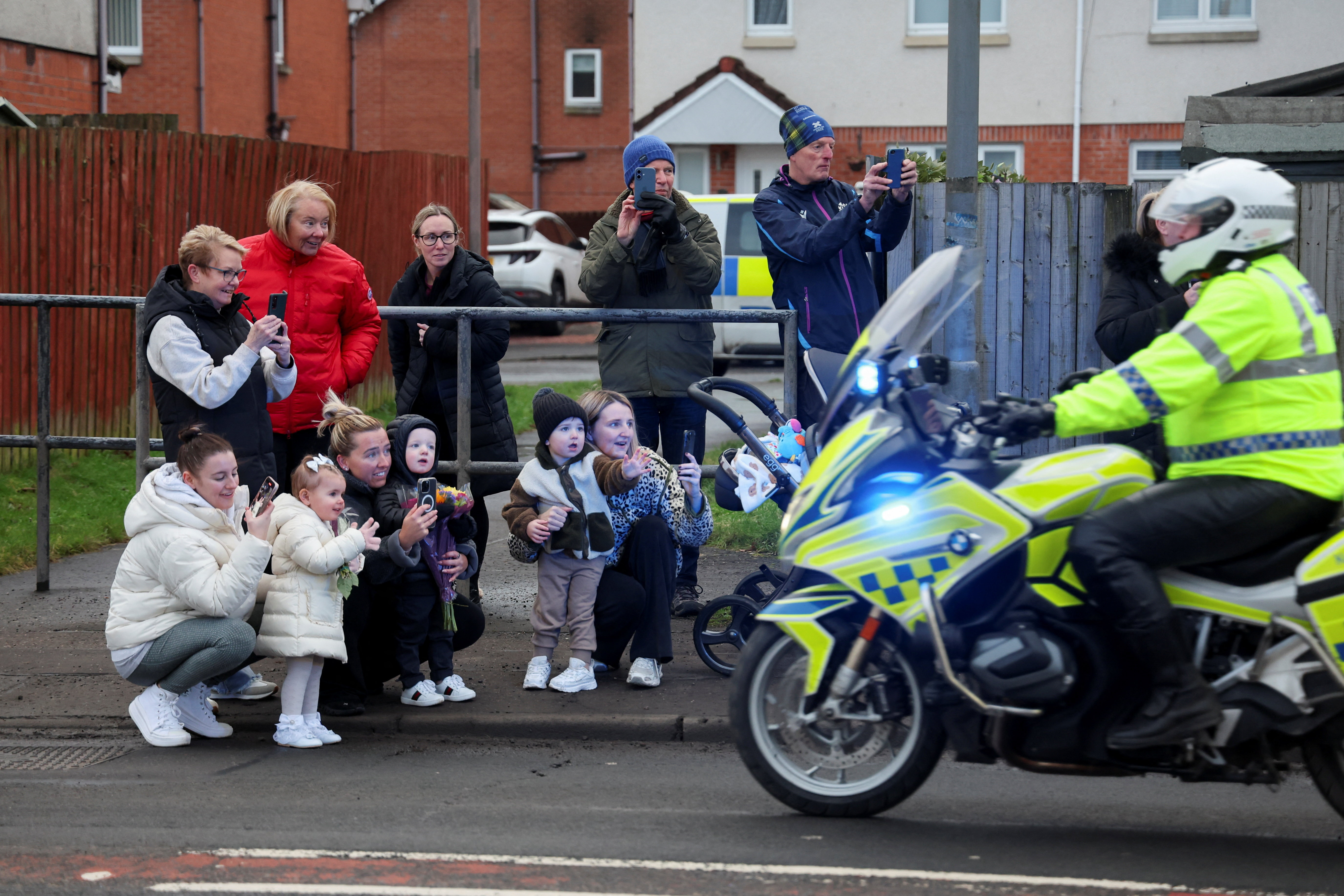 People watch as Prince William and Princess Catherine visit The Gothenburg, known locally as "The Goth," on 20 January 2026 in Stirling, Scotland. | Source: Getty Images