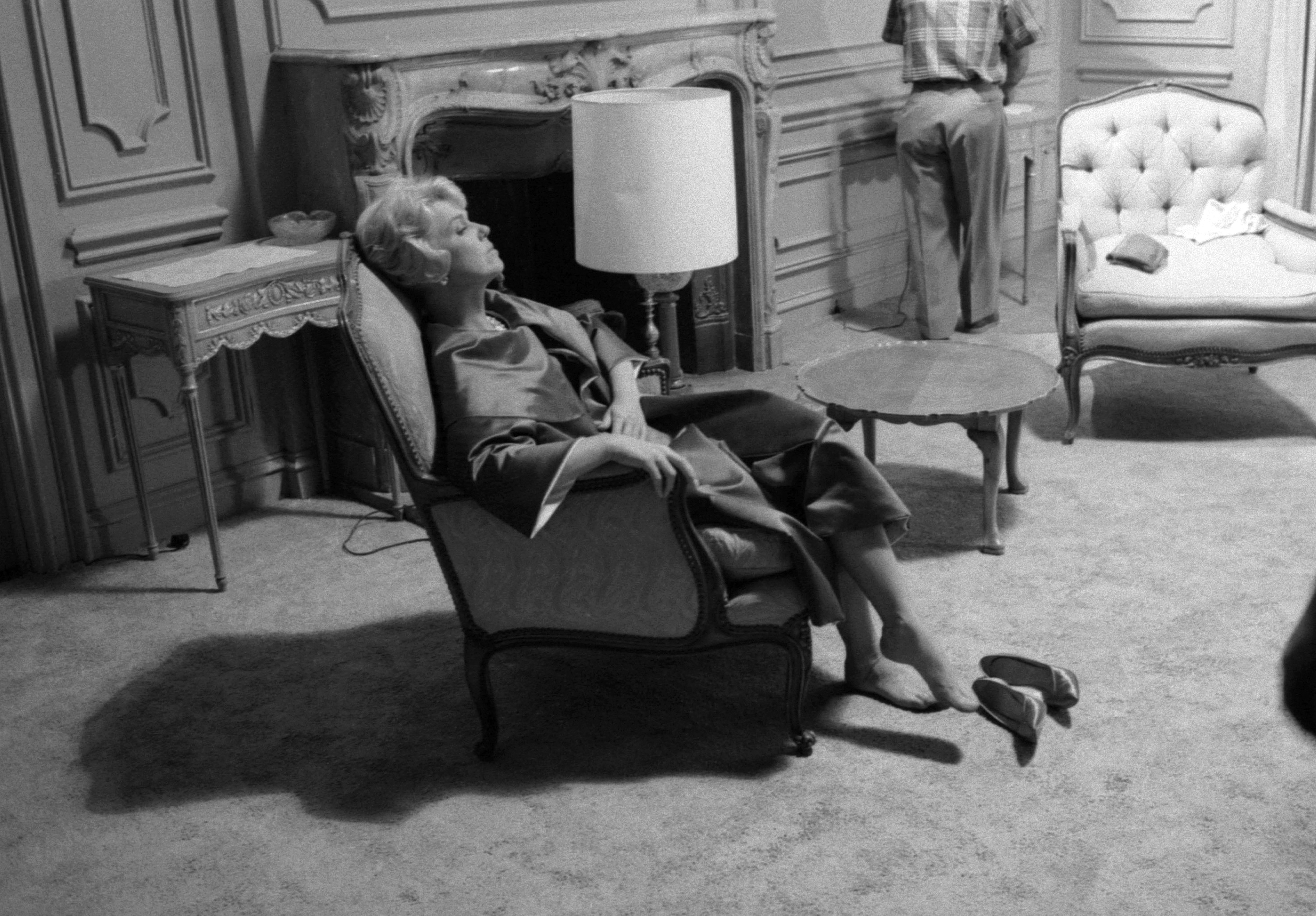 Doris Day captured sitting in a chair with her shoes off in 1959 in Los Angeles. / Source: Getty Images