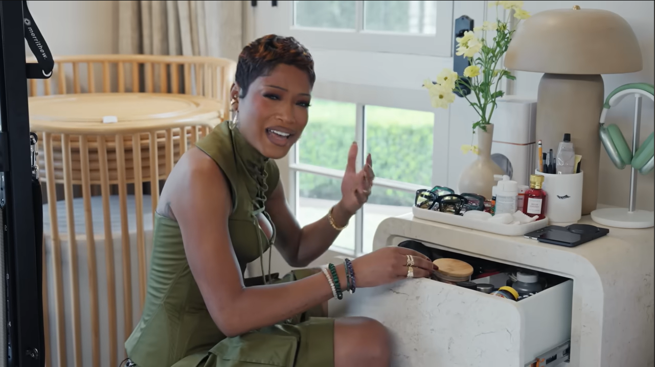 Peek inside her nightly rituals! Palmer opens her marble nightstand drawer to reveal a perfectly organized collection of glasses, vitamins, and sleep tapes. | Source: YouTube/@Archdigest