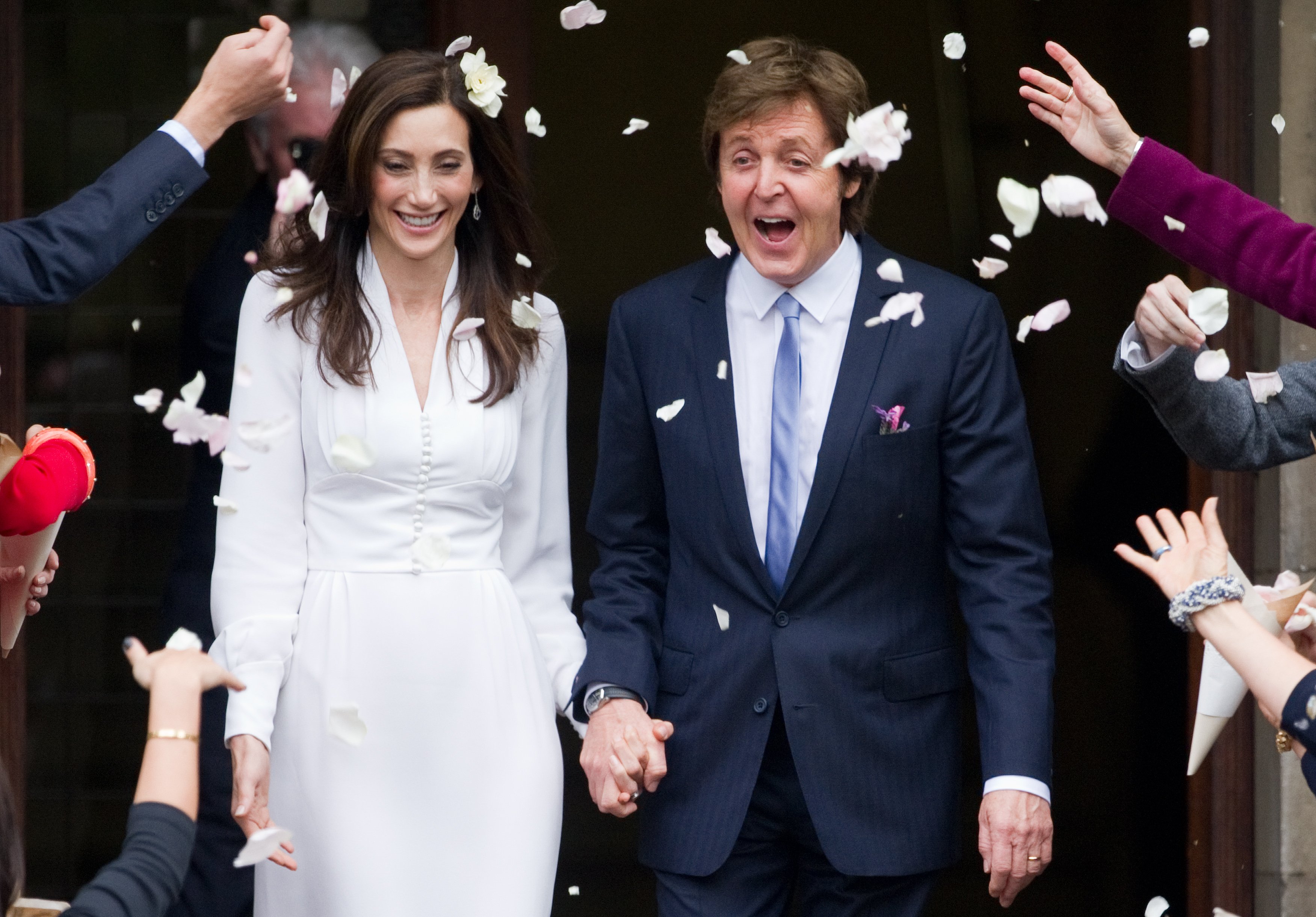 Sir Paul McCartney and his wife Nancy Shevell in central London after their wedding on October 9, 2011. | Source: Getty Images