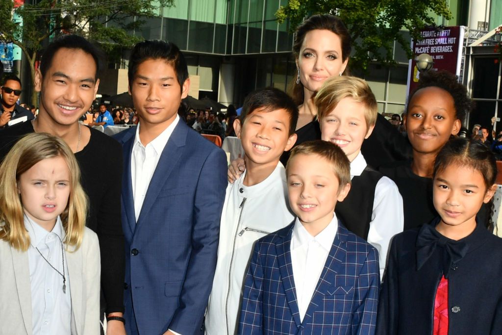 Angelina Jolie with her children Vivienne, Maddox, Pax, Knox, Shiloh, Zahara, and actors Kimhak Mun and Sareum Srey Moch at the Toronto International Film Festival in 2017 | Source: Getty Images