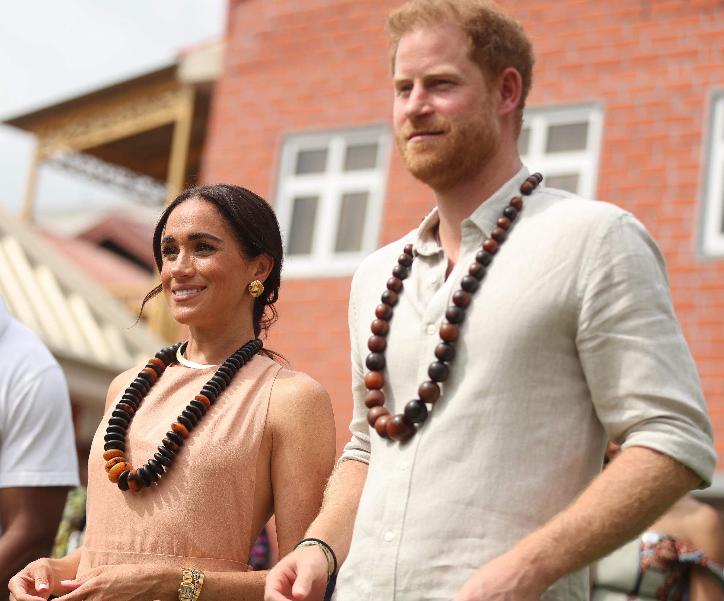 Duke of Sussex Prince Harry (R) his wife Meghan Markle (L), Duchess of Sussex, visit the Lightway Academy in Abuja, Nigeria as part of celebrations of Invictus Games anniversary on May 10, 2024 | Source: Getty Images