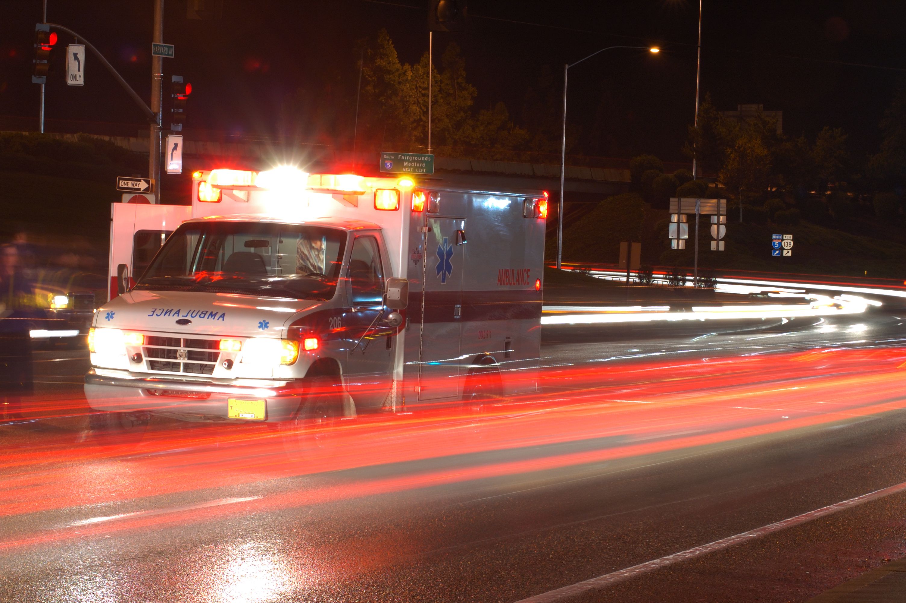 An ambulance drives through a street. | Source: Shutterstock