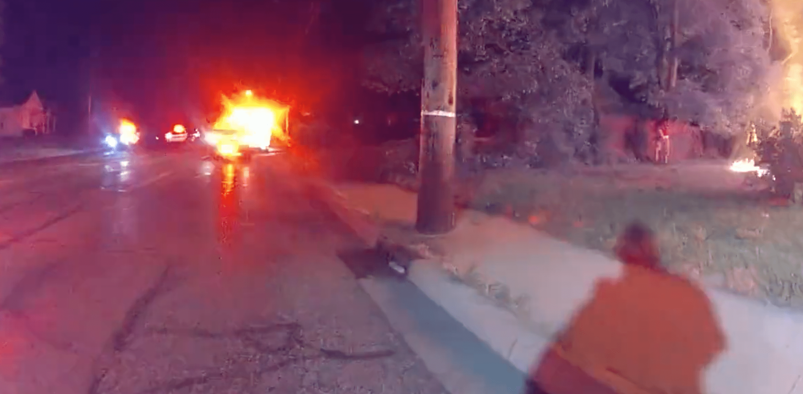 Body cam captures police and emergency services outside a burning house. | Source: Twitter.com/joesampaul