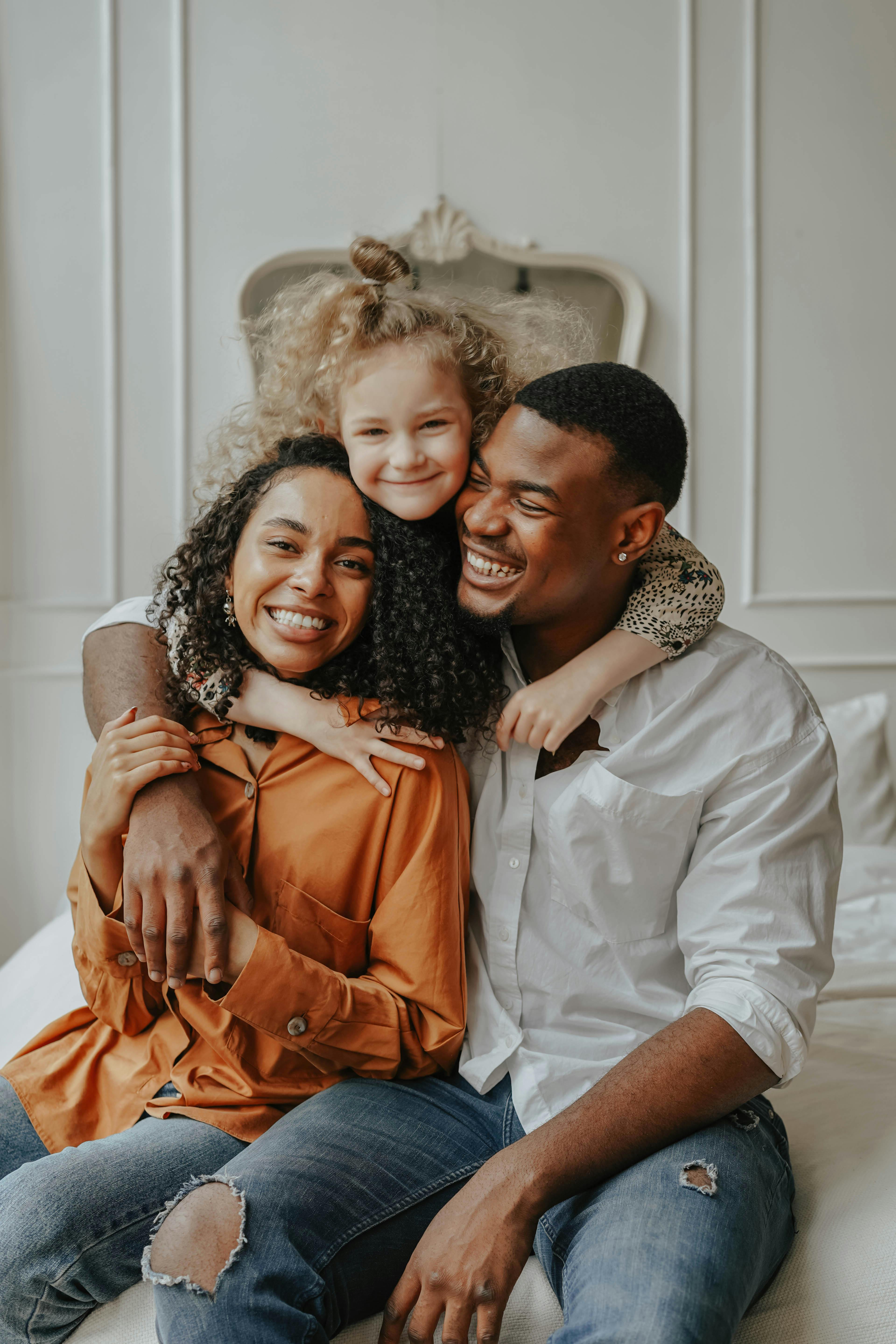 A happy girl with a couple | Source: Pexels