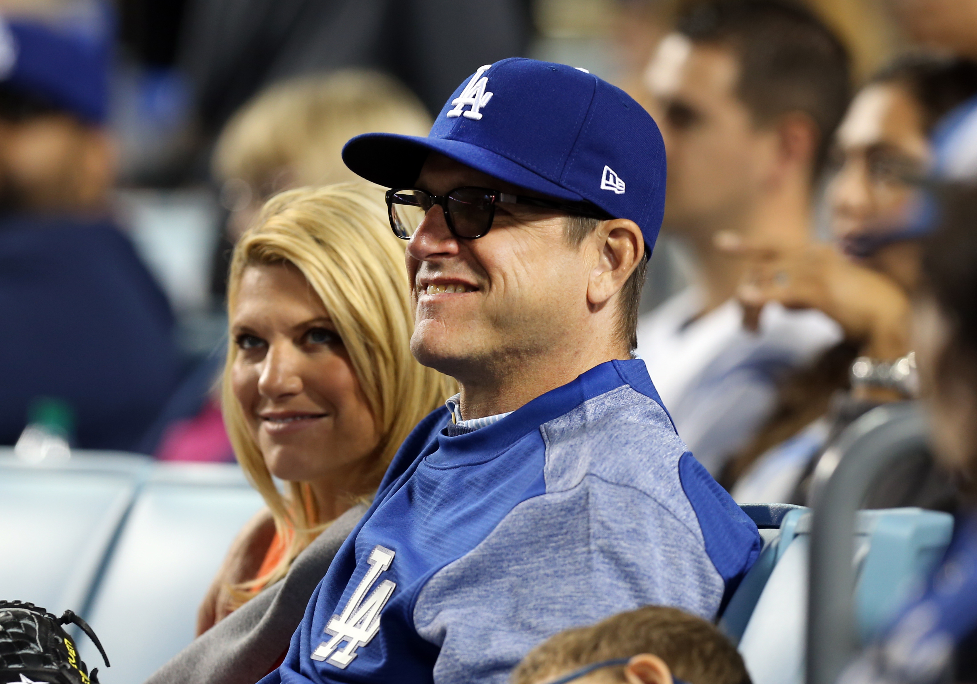 Sarah Feuerborn Harbaugh and Jim Harbaugh watch a game on May 8, 2017, at Dodger Stadium in Los Angeles, California | Source: Getty Images