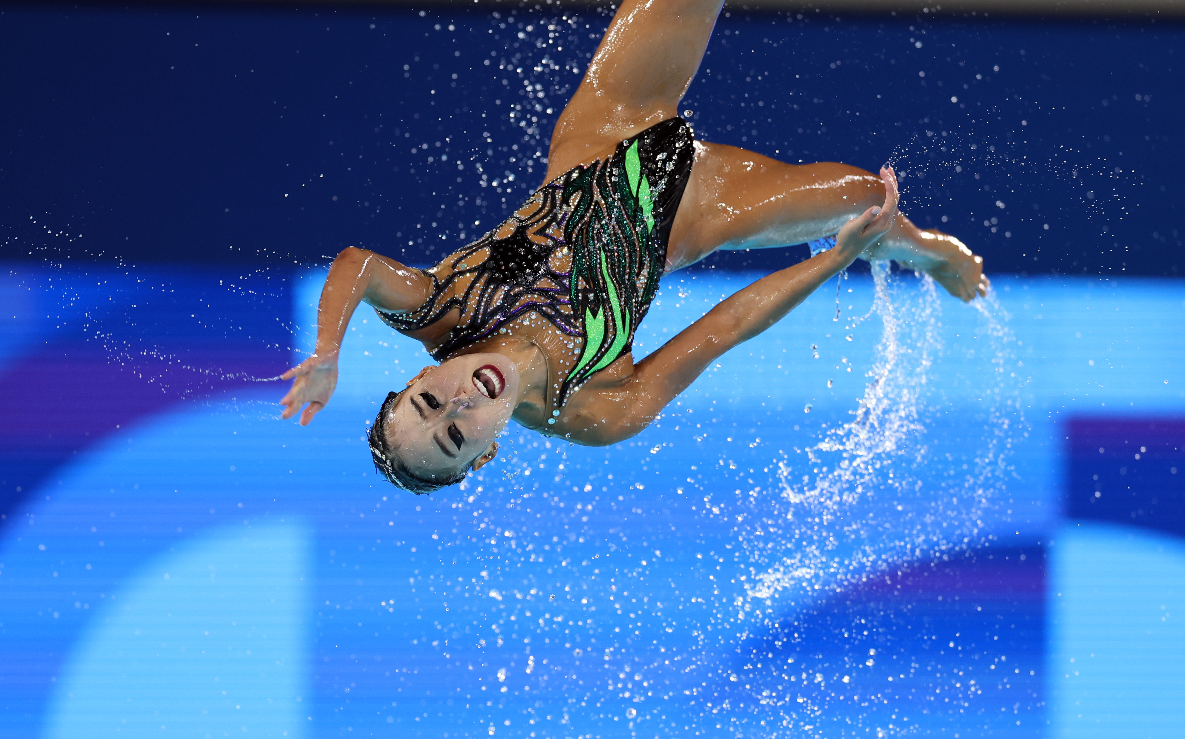 A member of Team USA photographed mid-air during the Team Acrobatic Routine at the Olympic Games in Paris on August 7, 2024. | Source: Getty Images