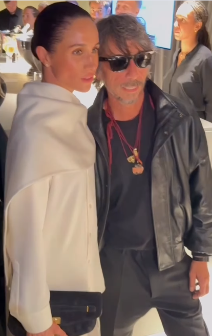 Meghan Markle and designer Pierpaolo Piccioli posing for photos at Paris Fashion Week on October 4, 2025 | Source: Instagram/wwd