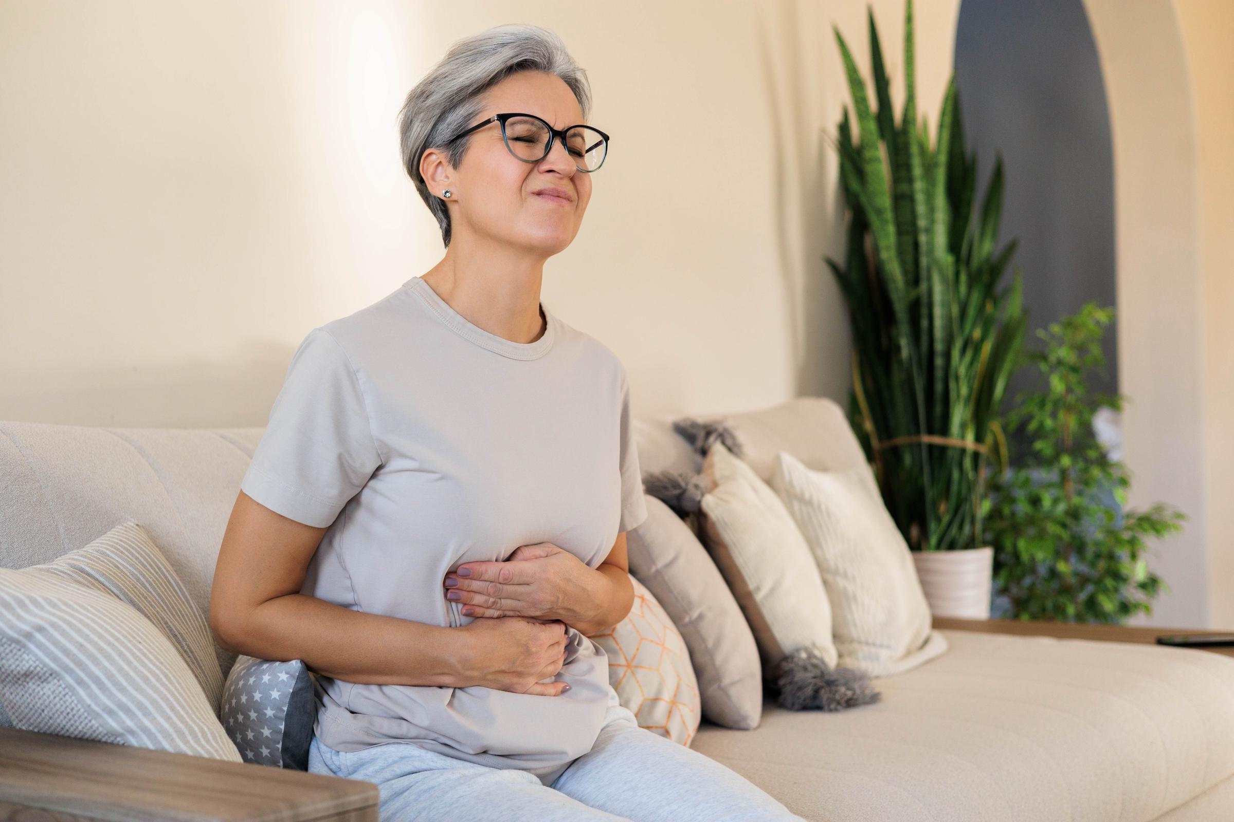Woman with a painful abdomen | Source: Shutterstock