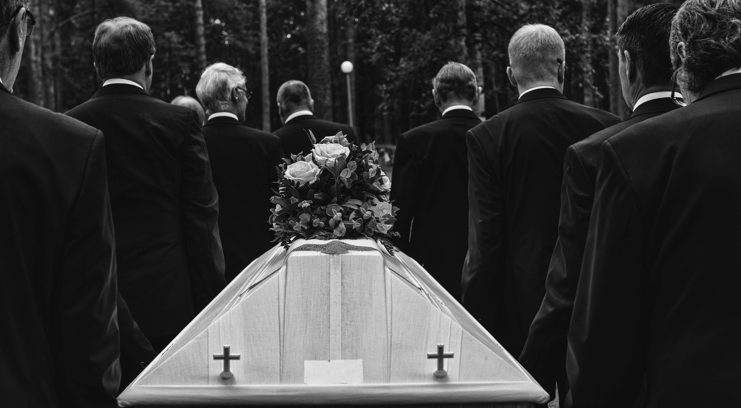 Men carrying a coffin | Source: Shutterstock