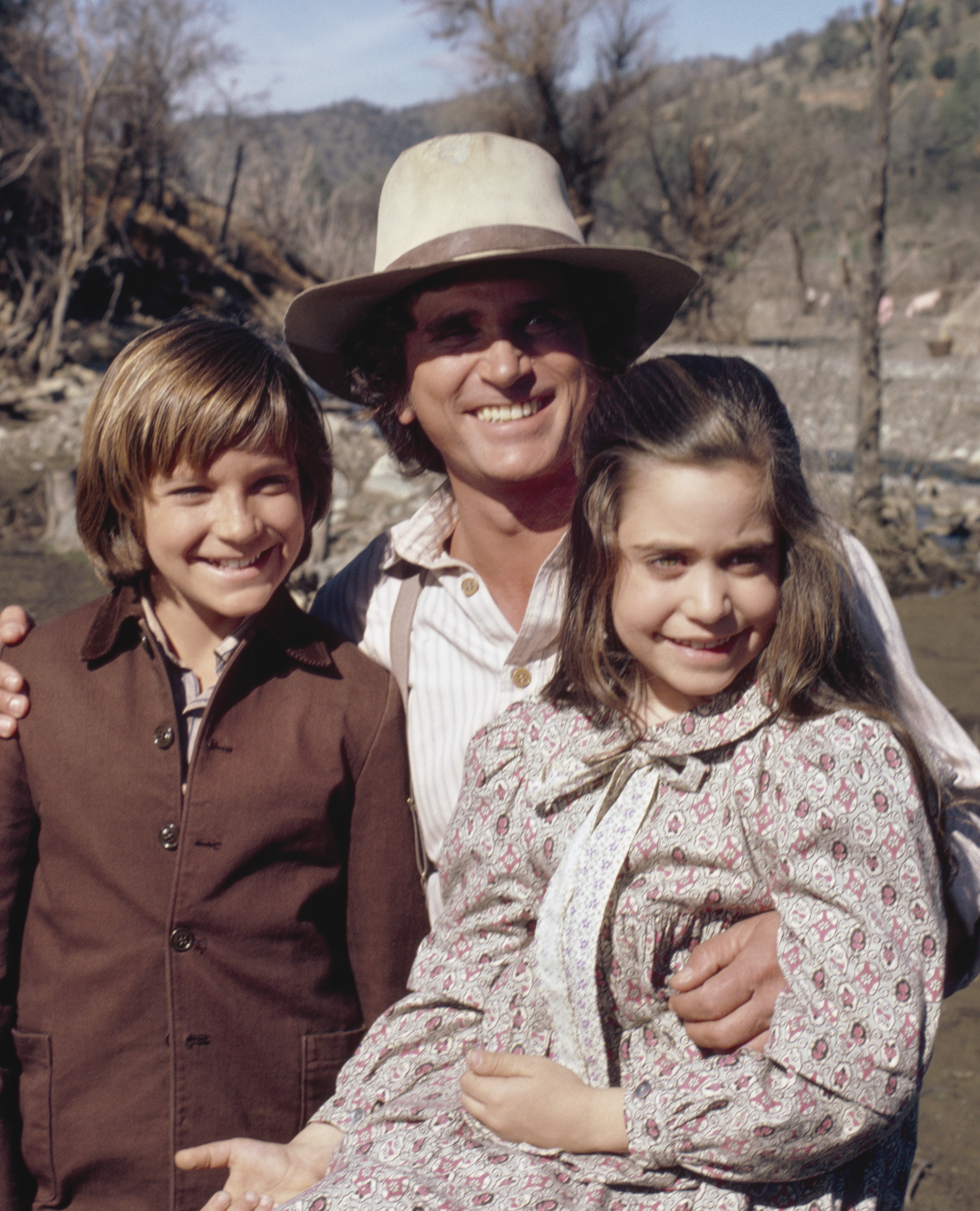 Jason Bateman as James Cooper Ingalls, Michael Landon as Charles Philip Ingalls, and Melissa Francis as Cassandra Cooper Ingalls, as seen on "Little House on the Prairie." | Source: Getty Images