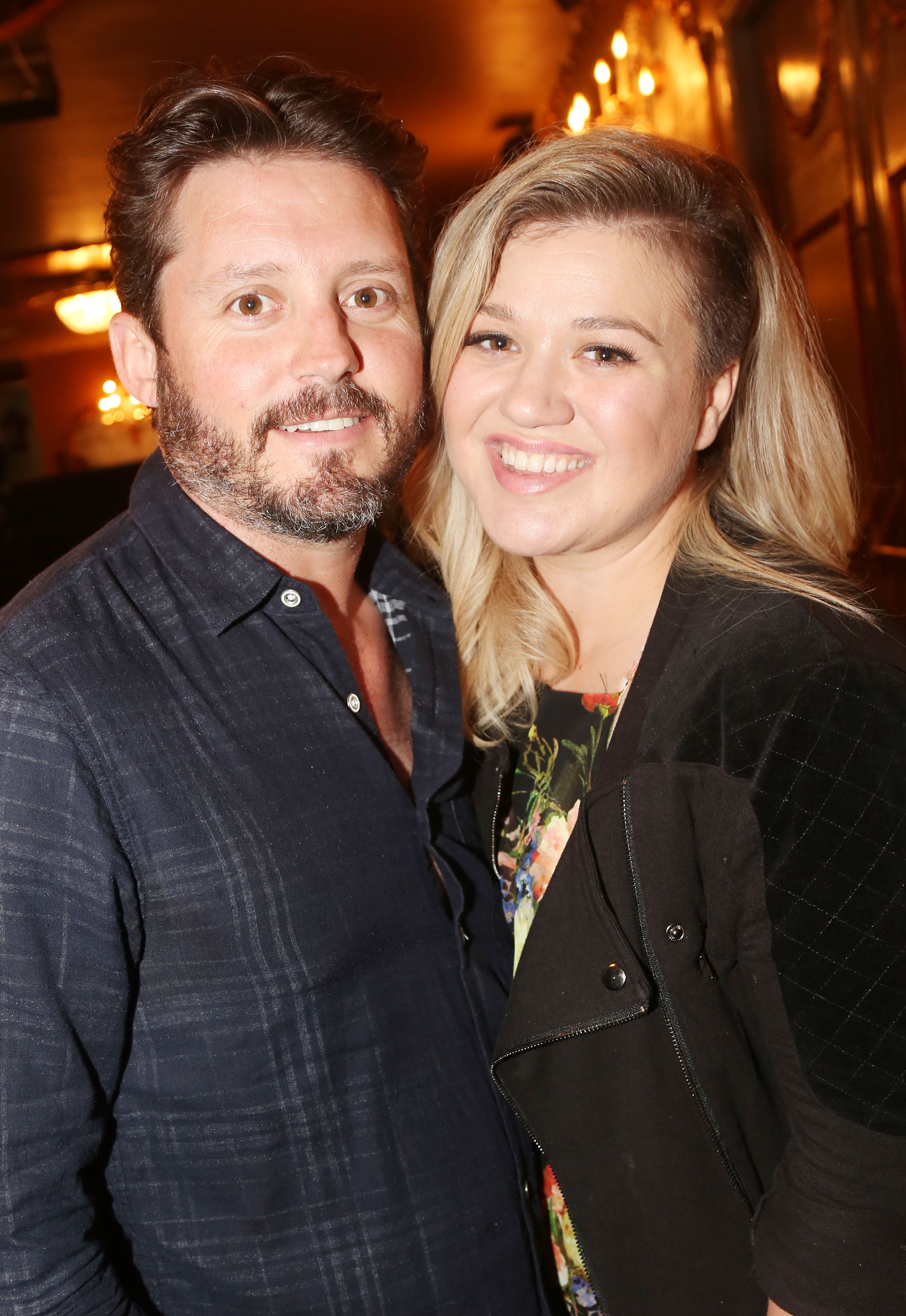 Brandon Blackstock and Kelly Clarkson backstage at the musical "Finding Neverland" on Broadway at The Lunt Fontanne Theater on July 15, 2015, in New York. | Source: Getty Images