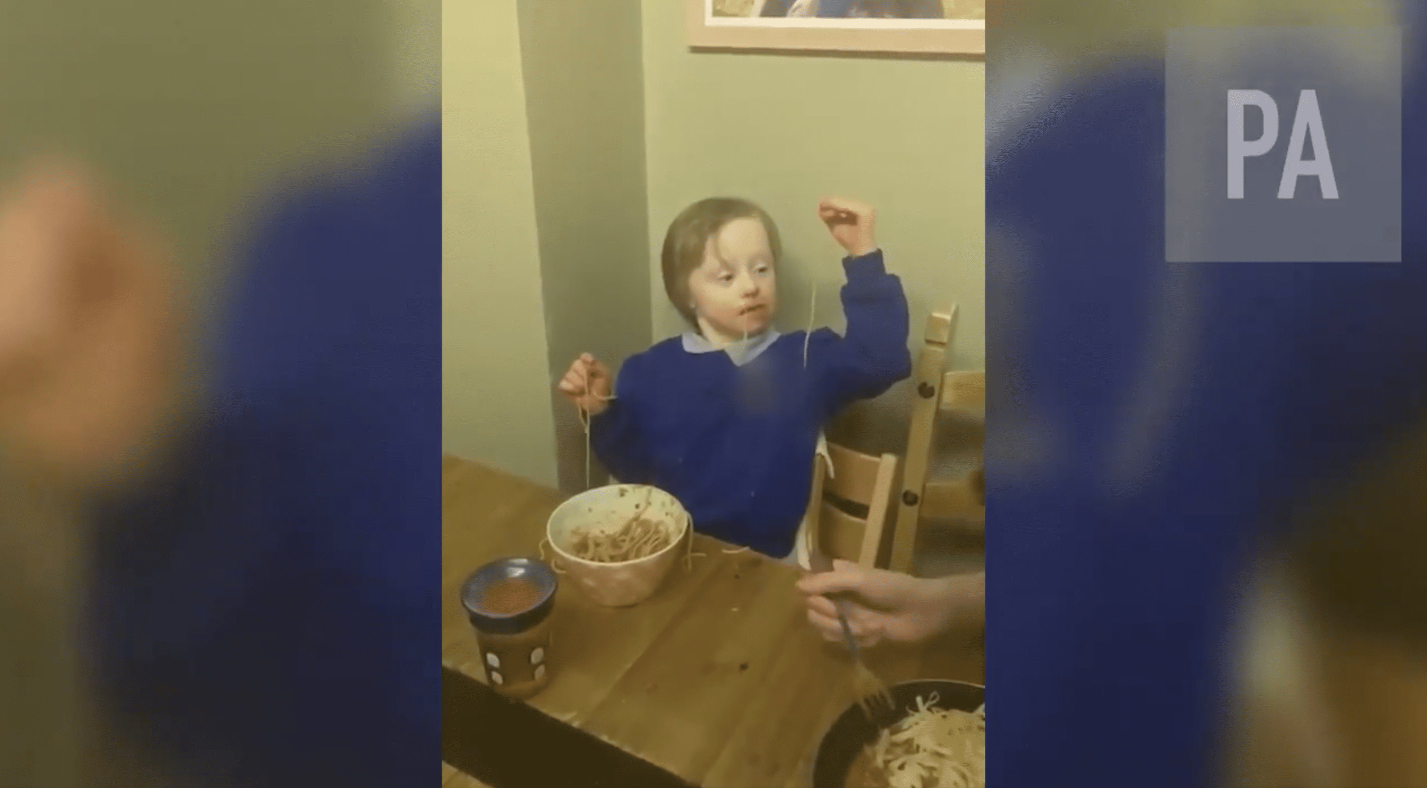 One of Emma Mullard's twin boys is pictured eating. | Source: twitter.com/PA