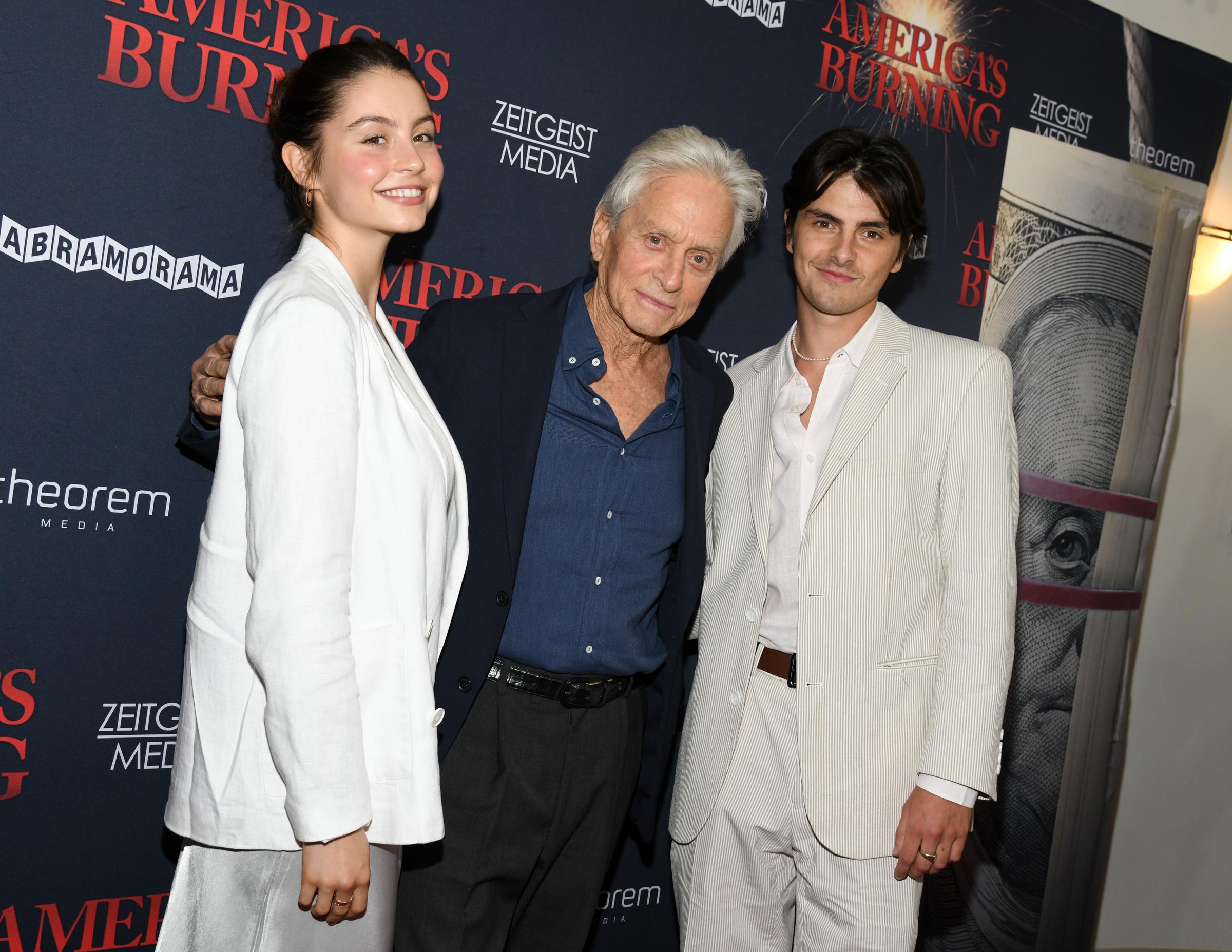 Michael Douglas and his children, Carys and Dylan Douglas, attend the "America's Burning" New York screening at DGA Theater on July 10, 2024. | Source: Getty Images