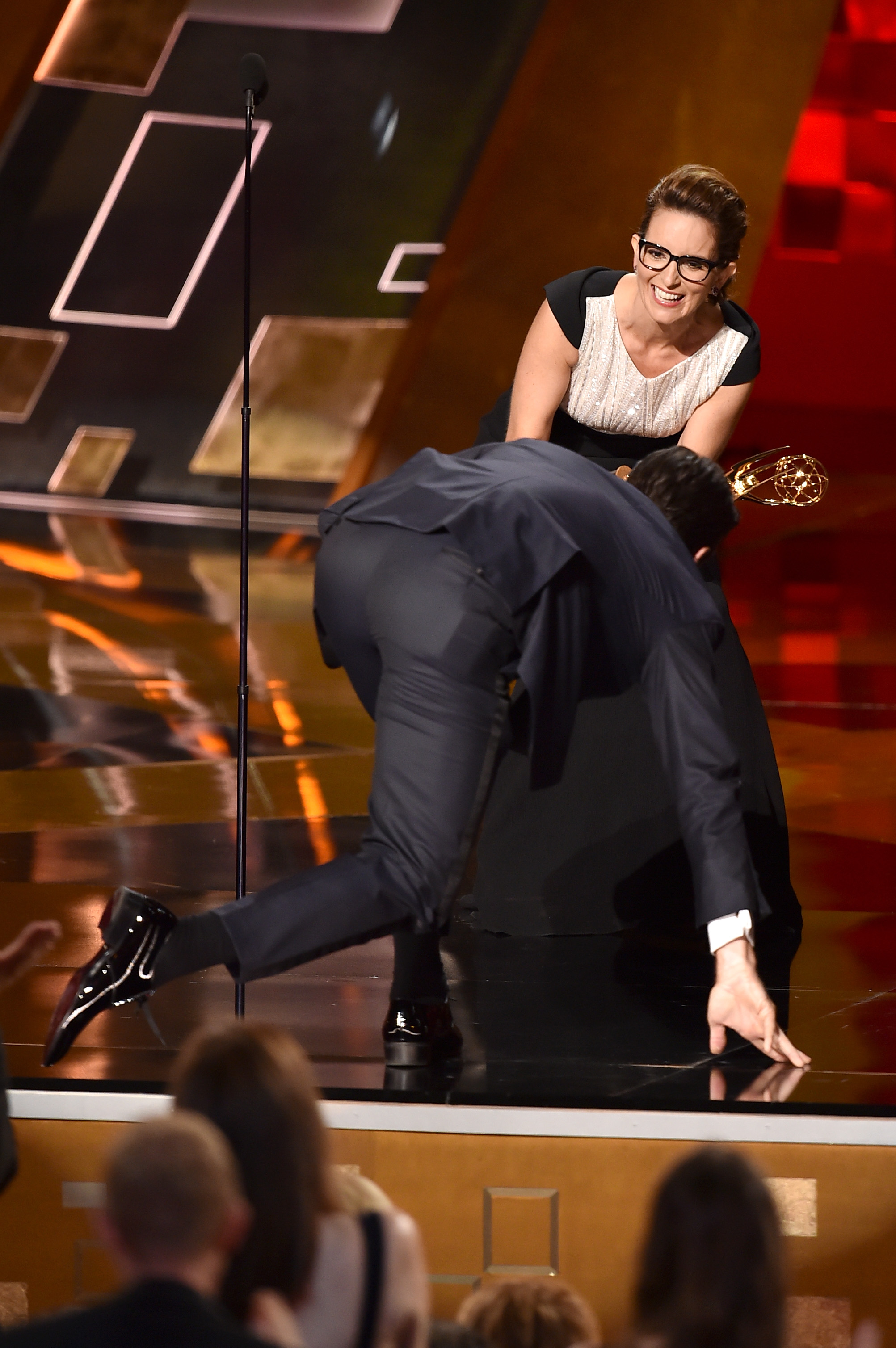 Jon Hamm climbing onstage to accept the Outstanding Lead Actor in a Drama Series award for "Mad Men" during the 67th Annual Primetime Emmy Awards on September 20, 2015, in Los Angeles, California. | Source: Getty Images