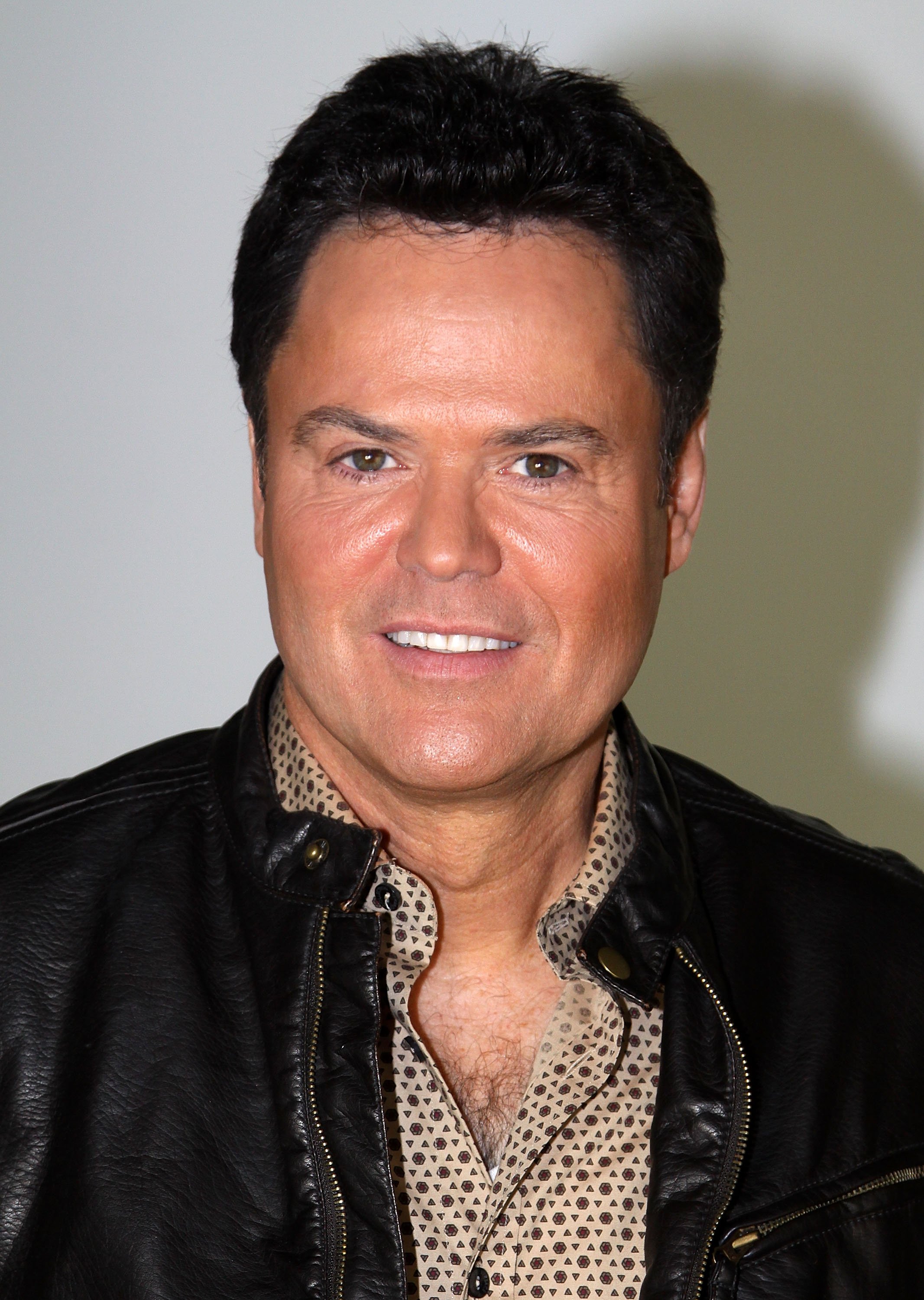 Donny Osmond poses as he promotes "A Broadway Christmas" at The Broadway.com Studios. | Source: Getty Images