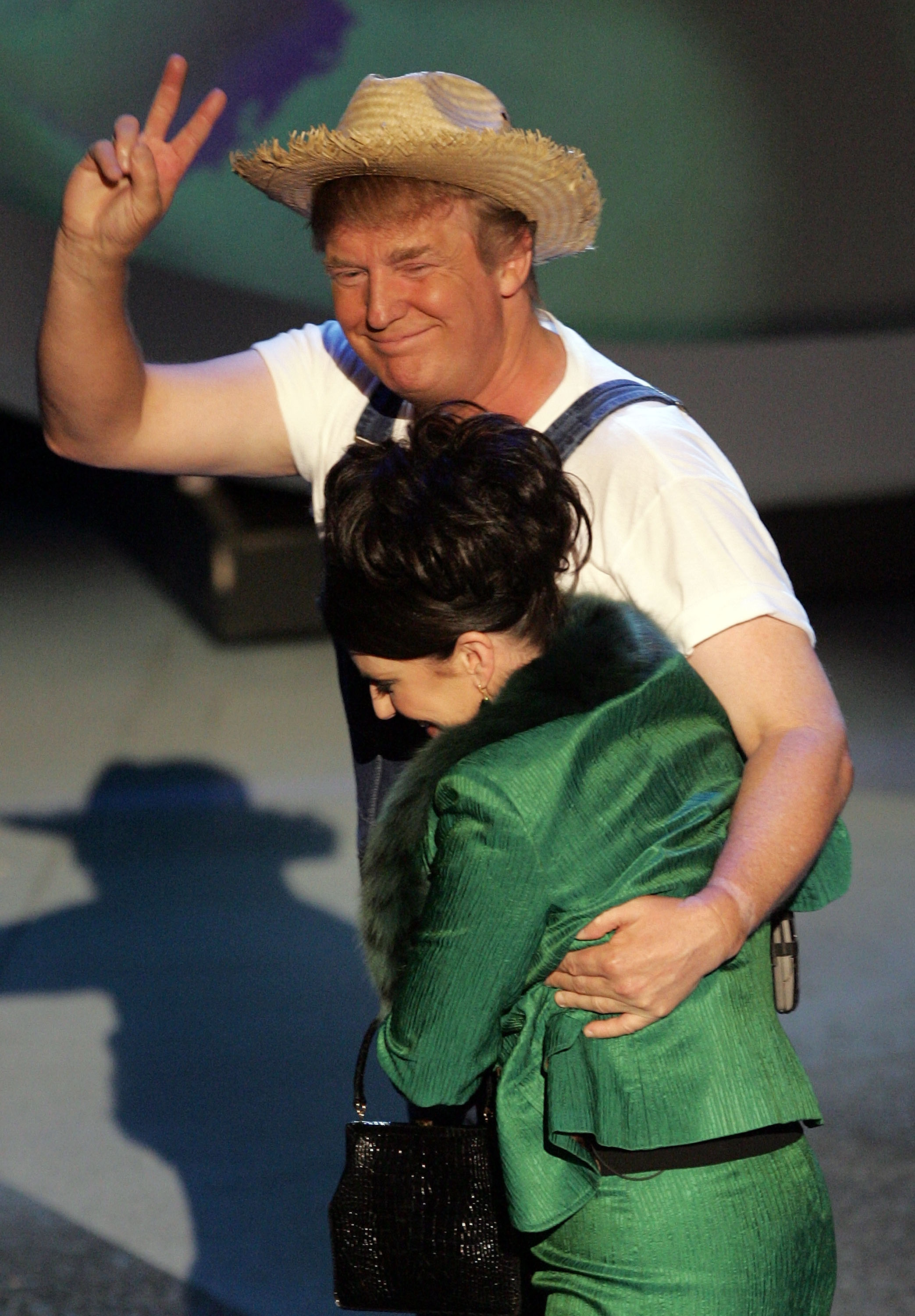 Donald Trump and Megan Mullally perform the "Green Acres" theme song onstage at the 57th Annual Emmy Awards on September 18, 2005, in Los Angeles, California. | Source: Getty Images