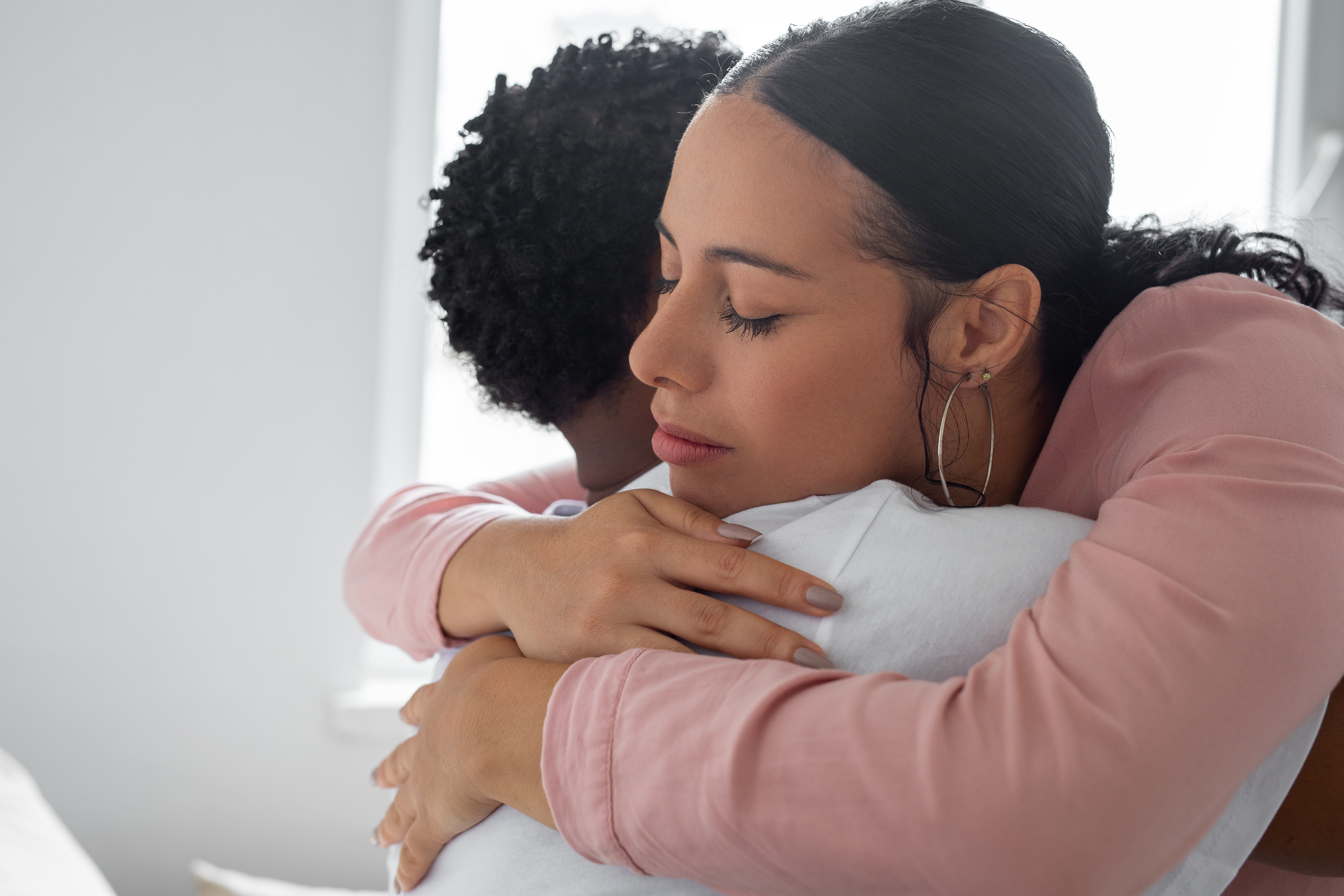 Couple hugging at home | Source: Getty Images