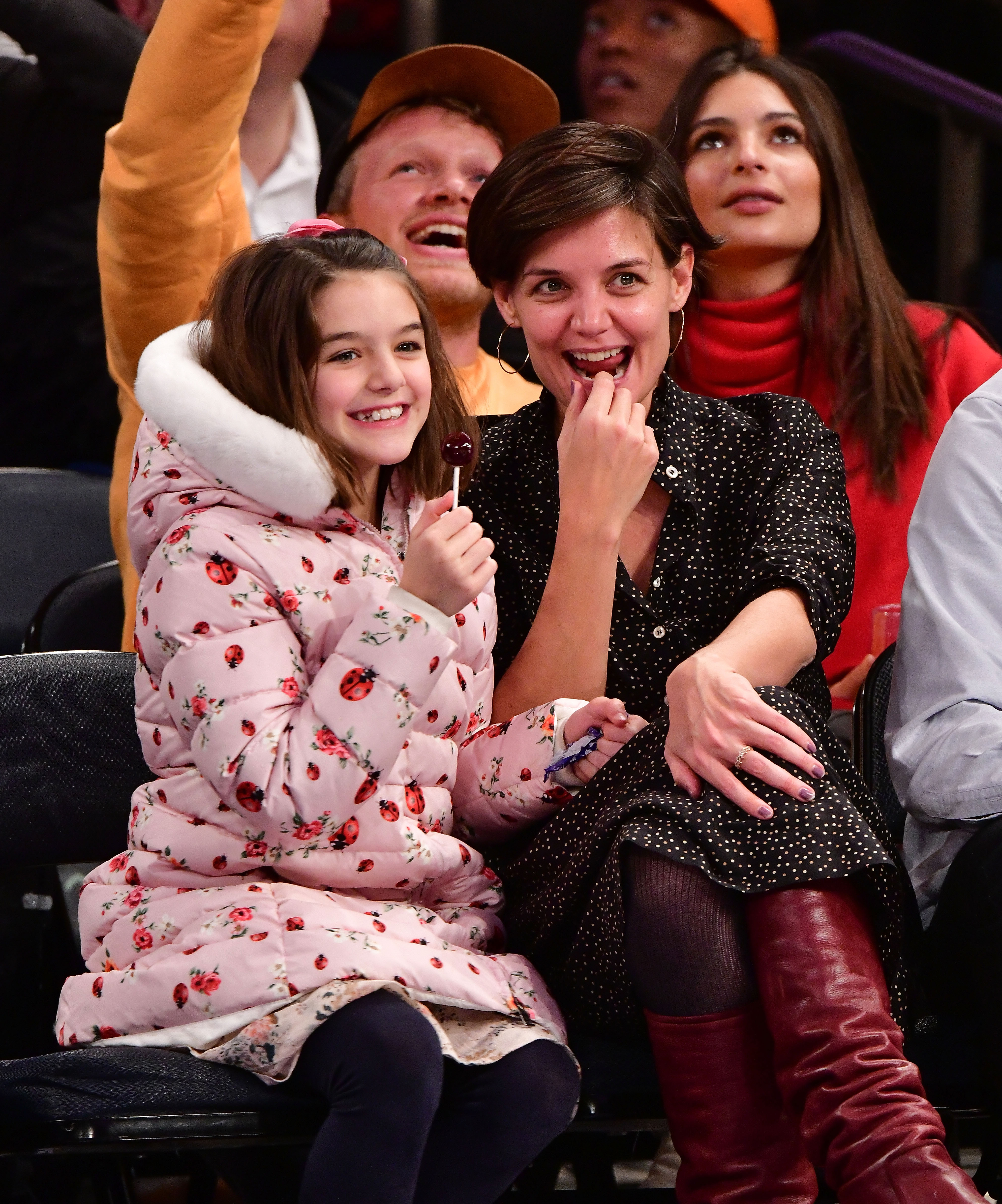 Suri Cruise and Katie Holmes are pictured at the Oklahoma City Thunder Vs New York Knicks game at Madison Square Garden on December 16, 2017, in New York City | Source: Getty Images