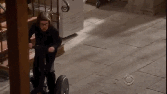Hetty wheeling her way around the office. | Source: Giphy.