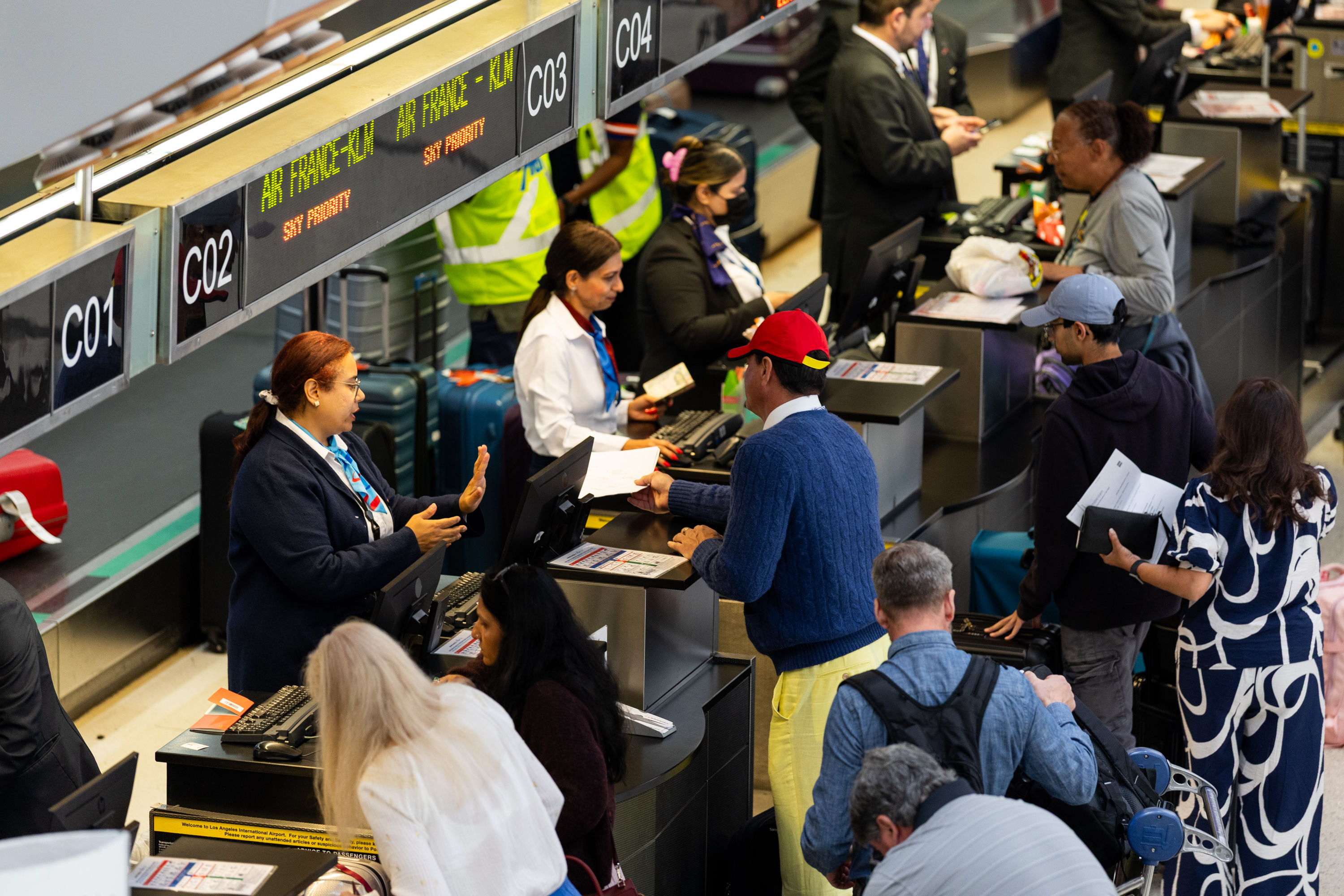 ICE Agents assisting passengers register at the Los Angeles International Airport on March 23, 2026 in Los Angeles, California. |Source: Getty Images