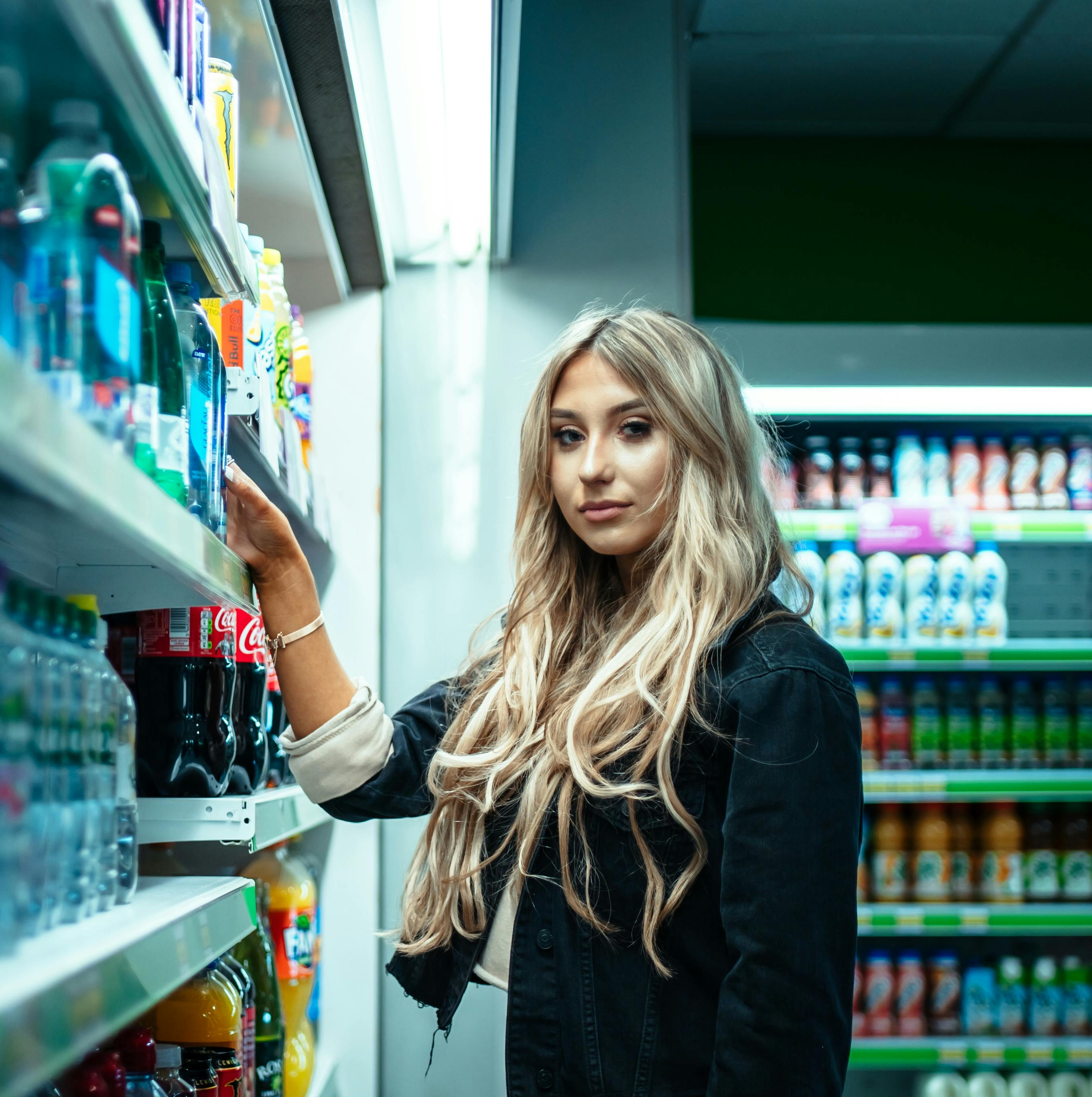 A woman beside a store shelf | Source: Pexels
