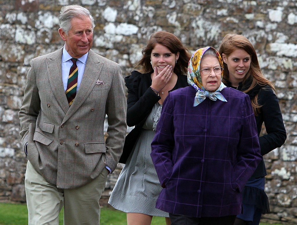 Queen Elizabeth II, Prince Charles, Princess Eugenie, and Princess Beatrice as they arrive in Western Isles of Scotland, on August 02, 2010 in Scrabster, Scotland. | Source: Getty Images