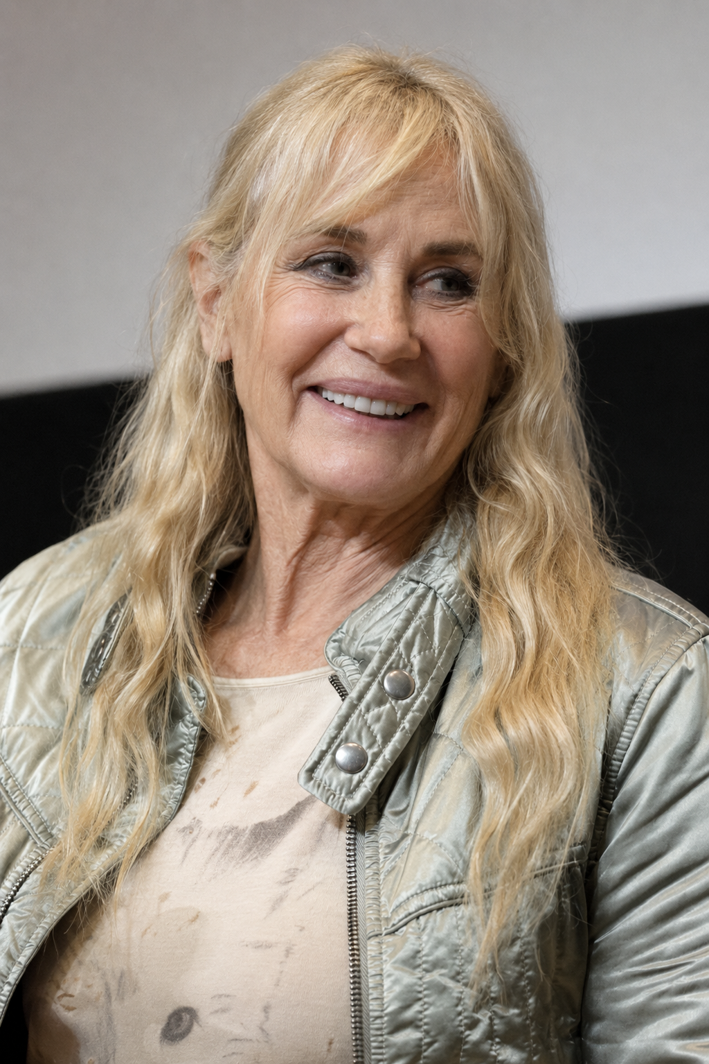 The collection imagines Hannah at a public appearance, wearing a quilted jacket and smiling during a speaking engagement. | Source: ChatGPT
