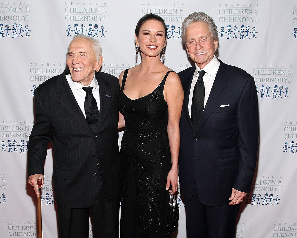 Kirk Douglas, Catherine Zeta-Jones, and Michael Douglas arrive at the 2011 Children of Chernobyl's Children, at Heart gala at the Chelsea Piers on November 21, 2011, in New York | Source: Getty Images (Photo by Taylor Hill/FilmMagic)