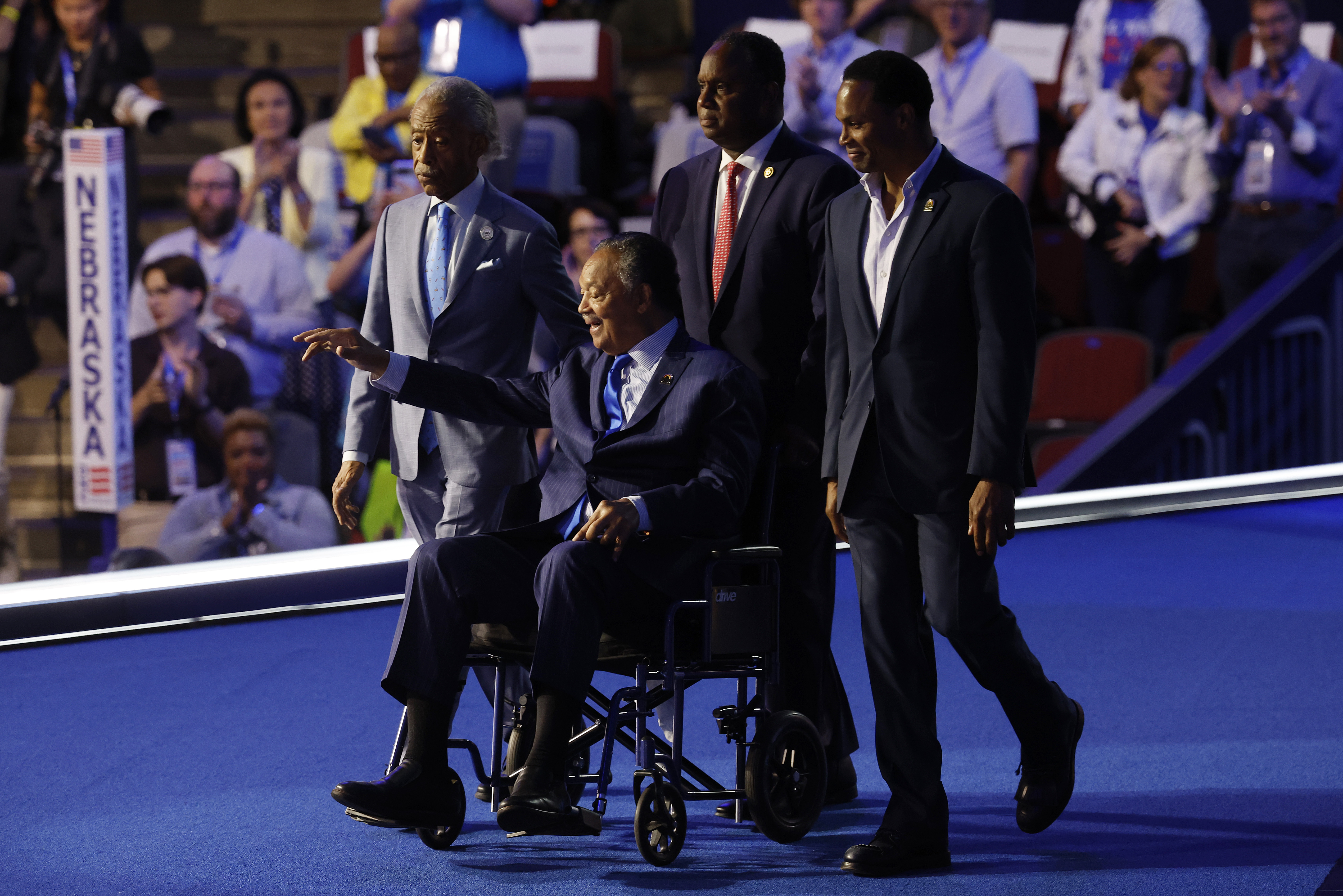 Jesse Jackson waves onstage during the Democratic National Convention (DNC) on August 19, 2024 | Source: Getty Images