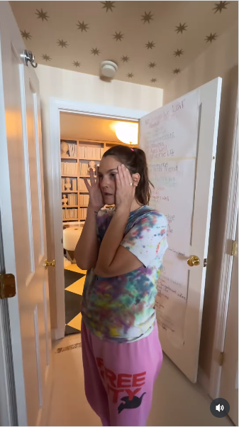 Drew Barrymore holding her head expressing frustration while renovating her home from a video posted on July 21, 2025 | Source: Instagram/drewbarrymore